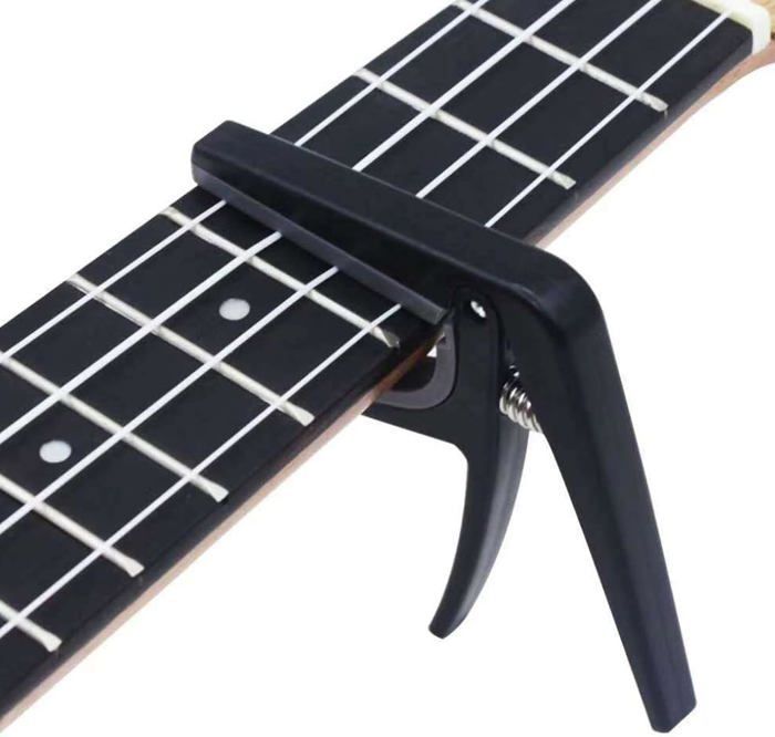 Guitar capo, quick-release ukulele capo, tone-changing instrument accessory