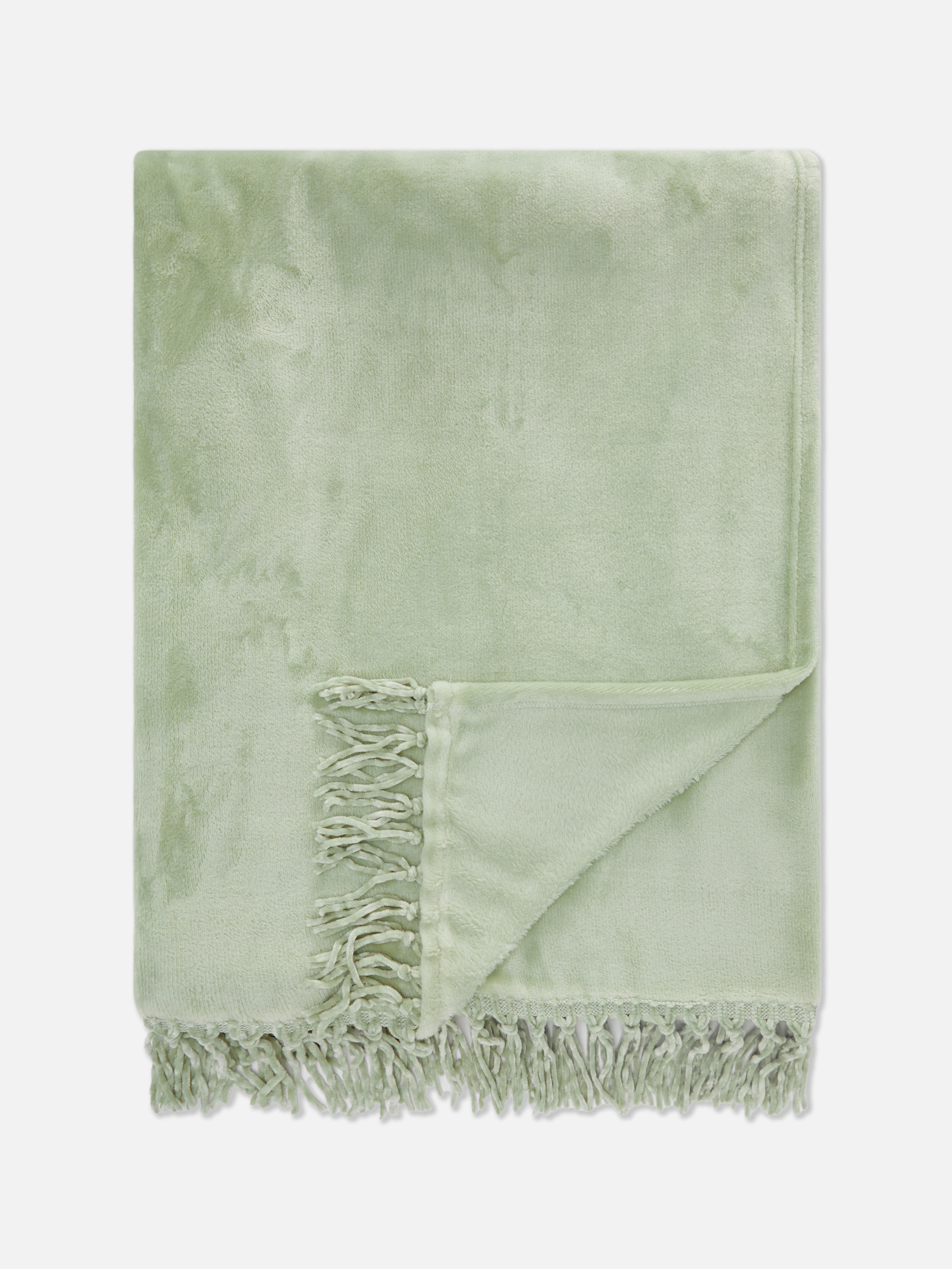 Pătură mare de pluș cu ciucuri O pătură mare de pluș cu ciucuri
