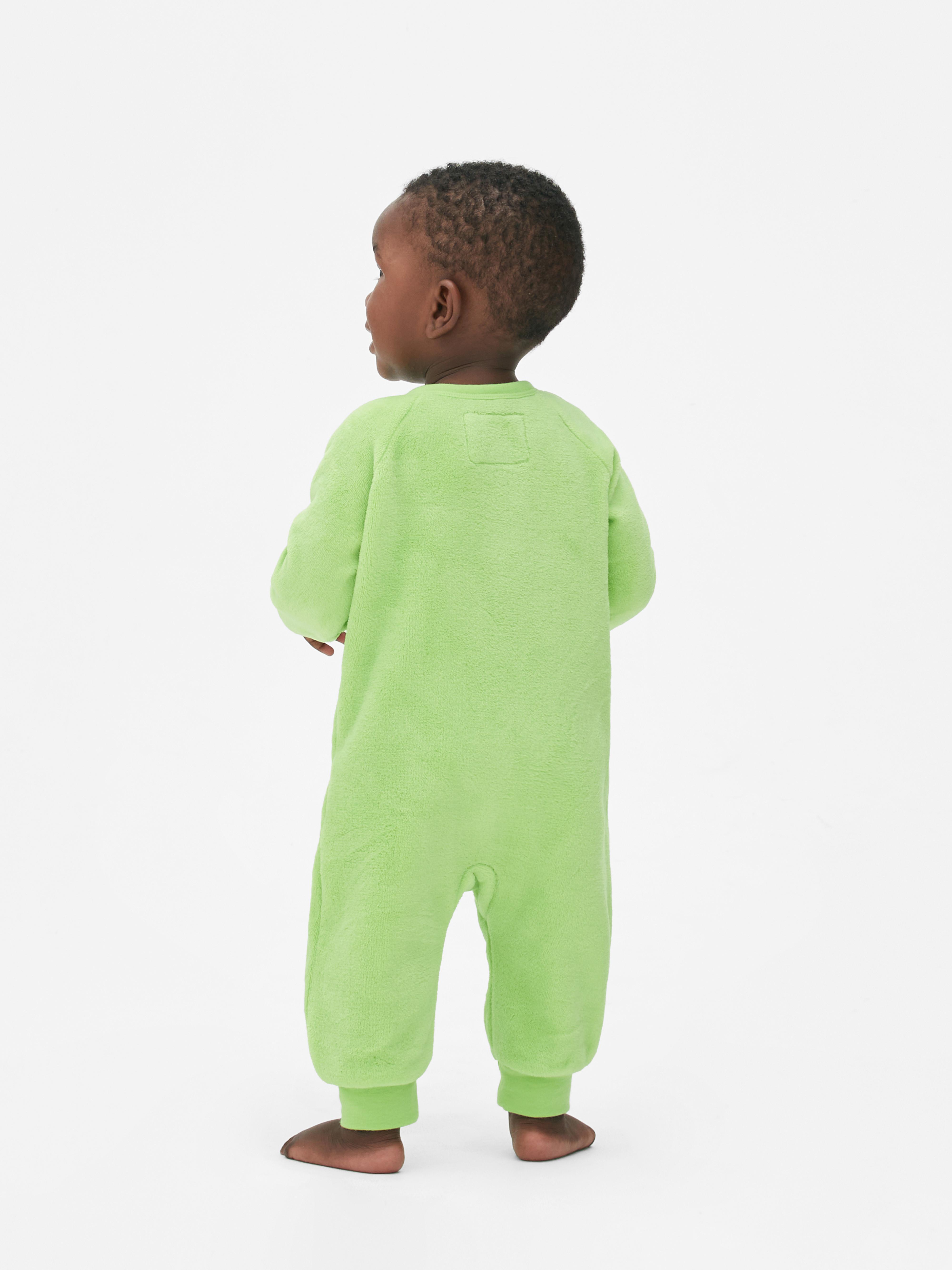Salopetă din fleece cu fermoar pentru bebeluși Monsters, Inc. O salopetă pentru bebeluși de la Monsters, Inc. cu coarne și un ochi ca al curajosului Mike Wazowski