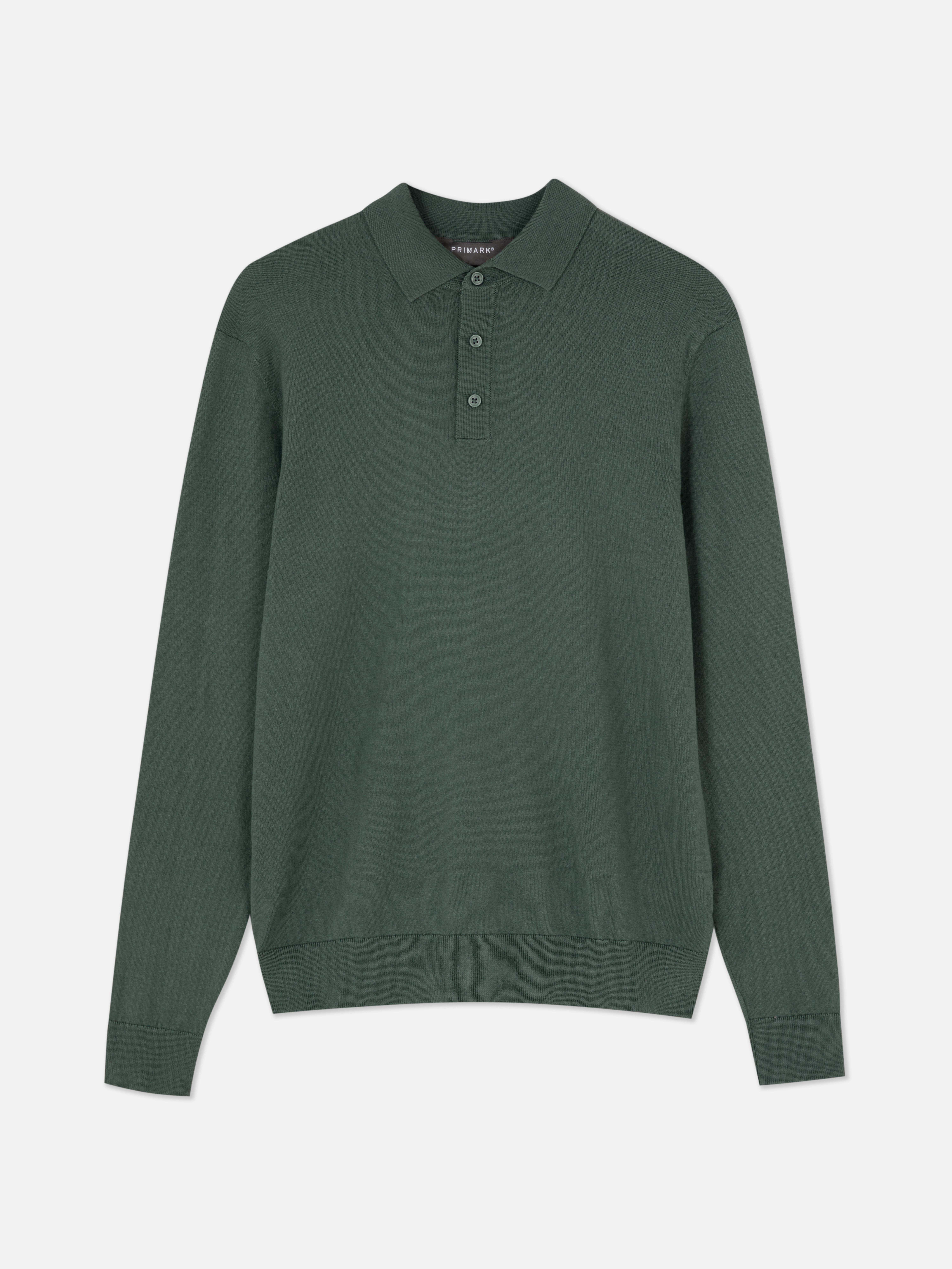 Pulover cu mânecă lungă. Acest tricou polo tricotat are guler, fentă cu nasturi și mâneci lungi.