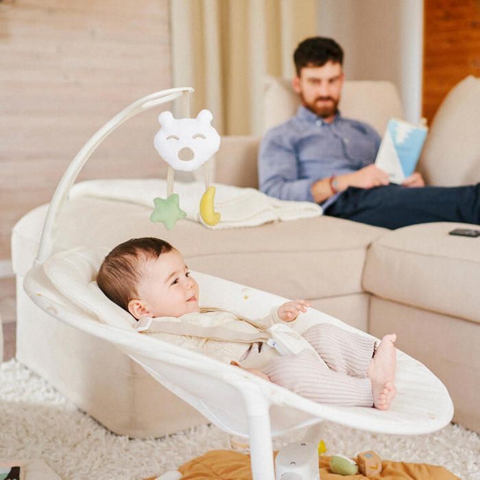 Badabulle Buddy Cream Side-Swept Electric Baby Swing - 3 Swing Speeds, 8 Lullabies, Toy Bar, Lifetime Warranty