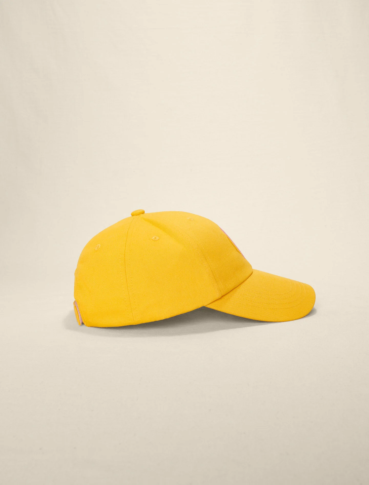 Katoenen pet met het Clover-Jaune soleil logo.