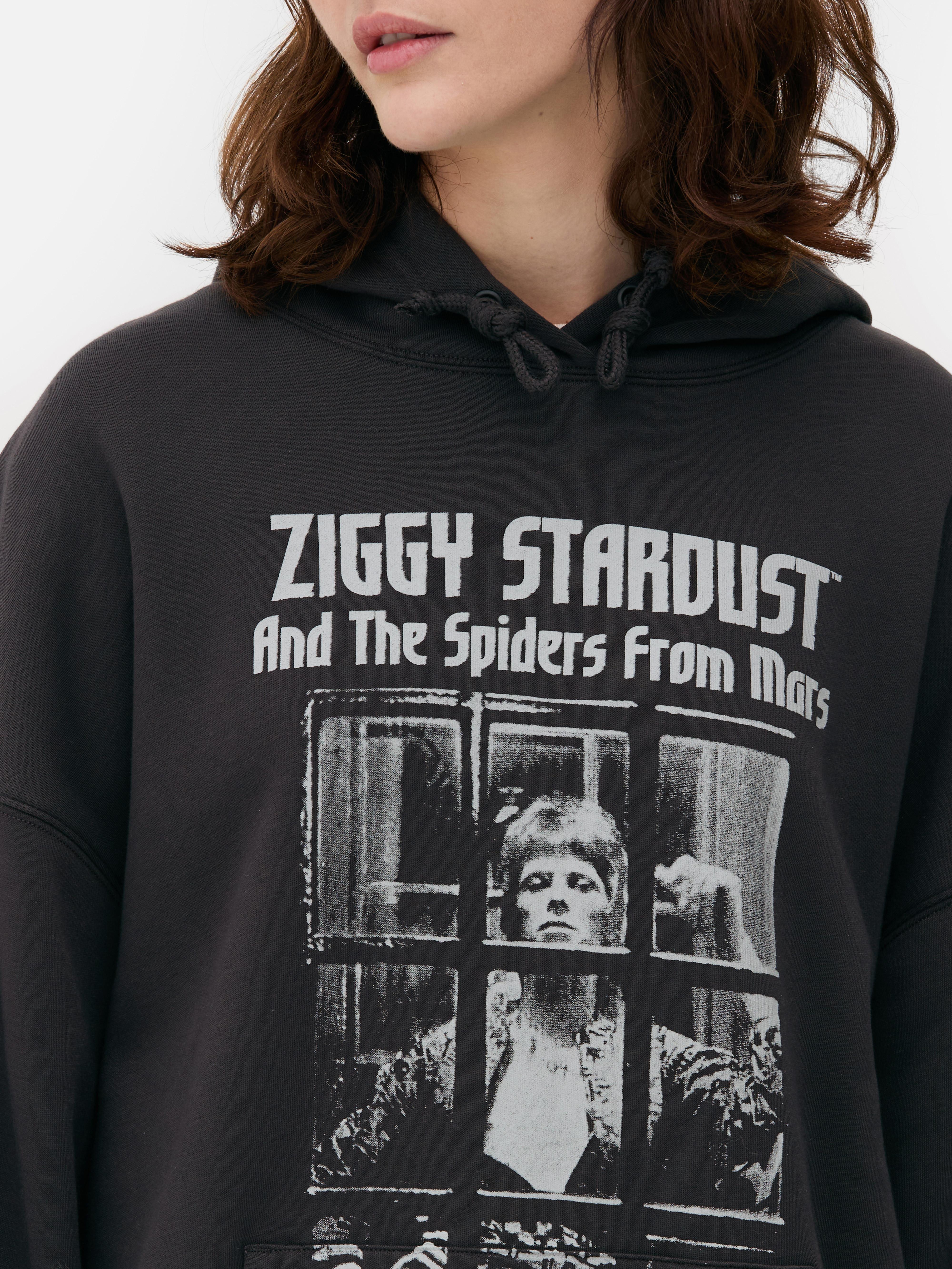 Túlméretezett David Bowie kapucnis pulóver Túlméretezett kapucnis pulóver David Bowie mintával, húzózsinórral, bordázott mandzsettával és kenguruzsebbel