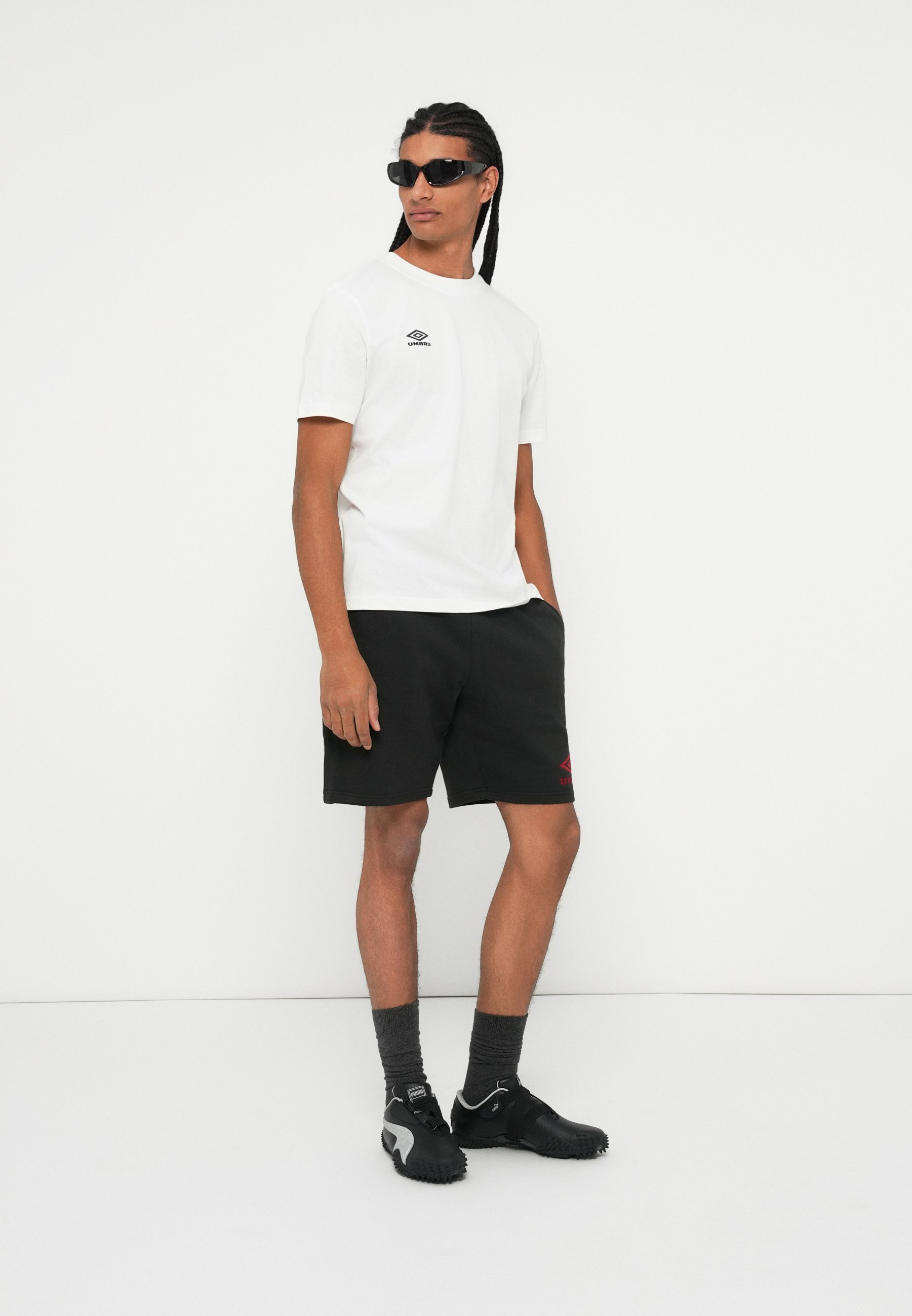 Pantaloncini Umbro ICONIC SHORT - Pantaloni della tuta - nero/peperoncino