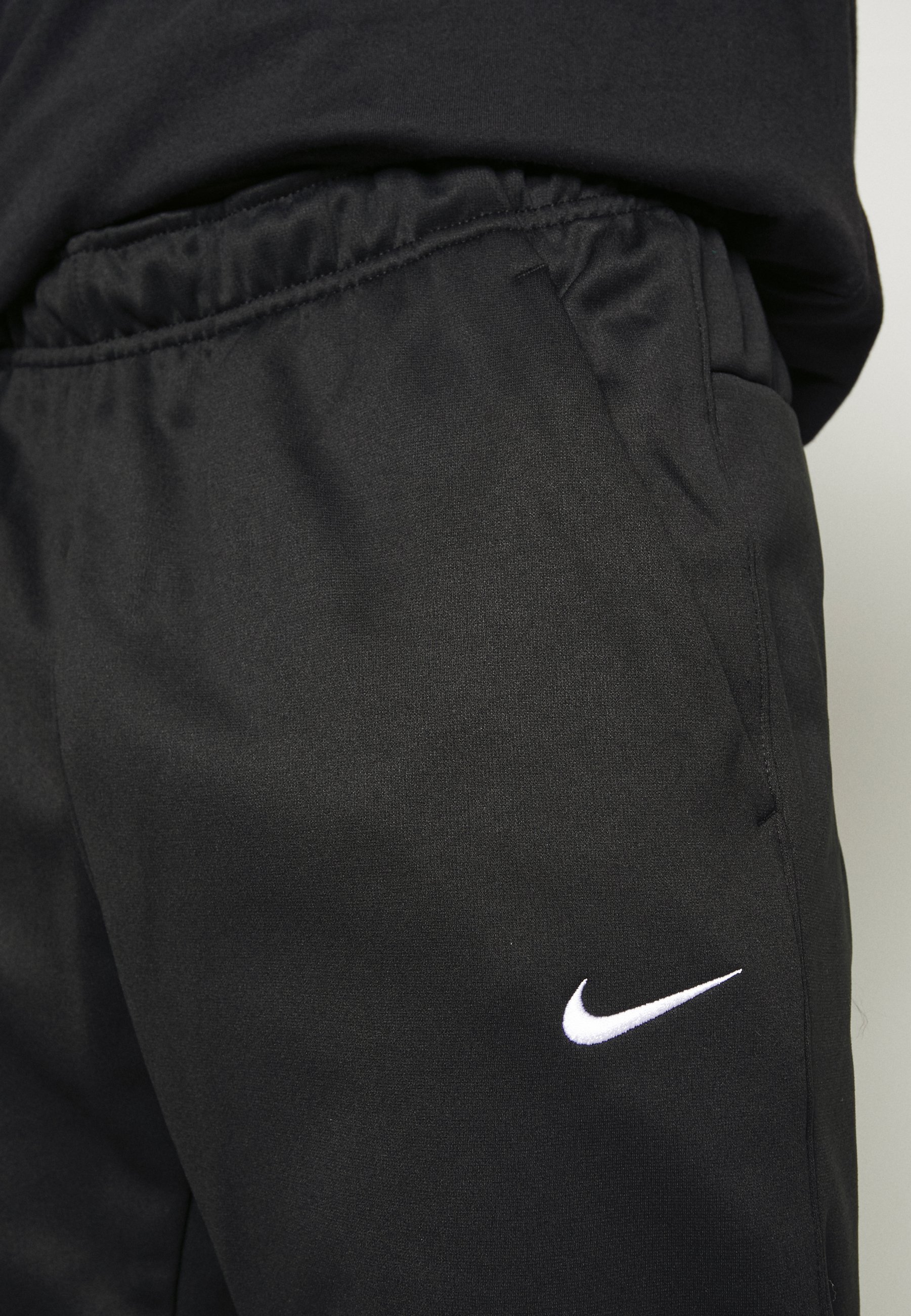 Pantaloni da tuta Nike Performance TAPER - nero/bianco