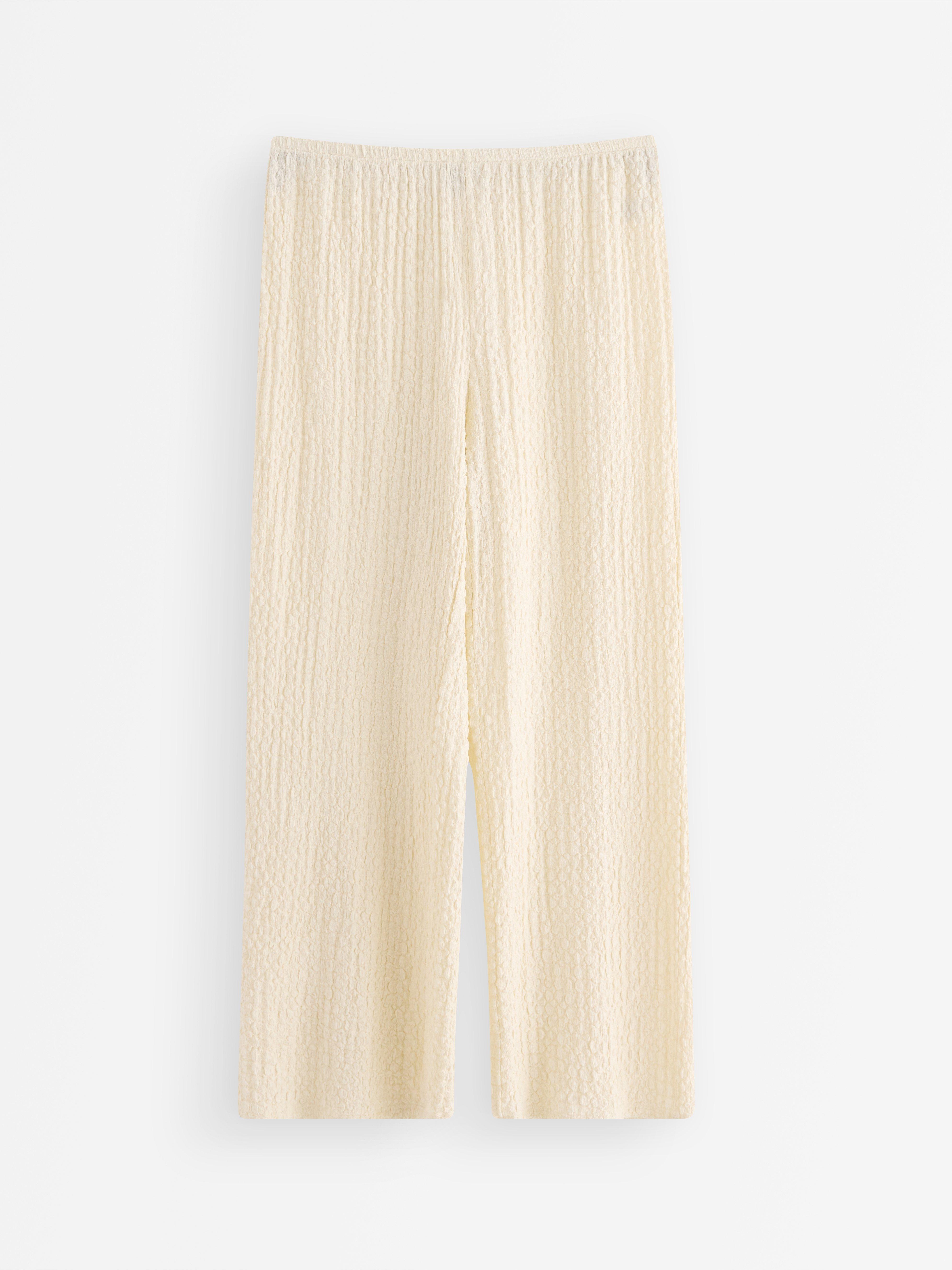 Pantalones de punto texturizado color blanco roto