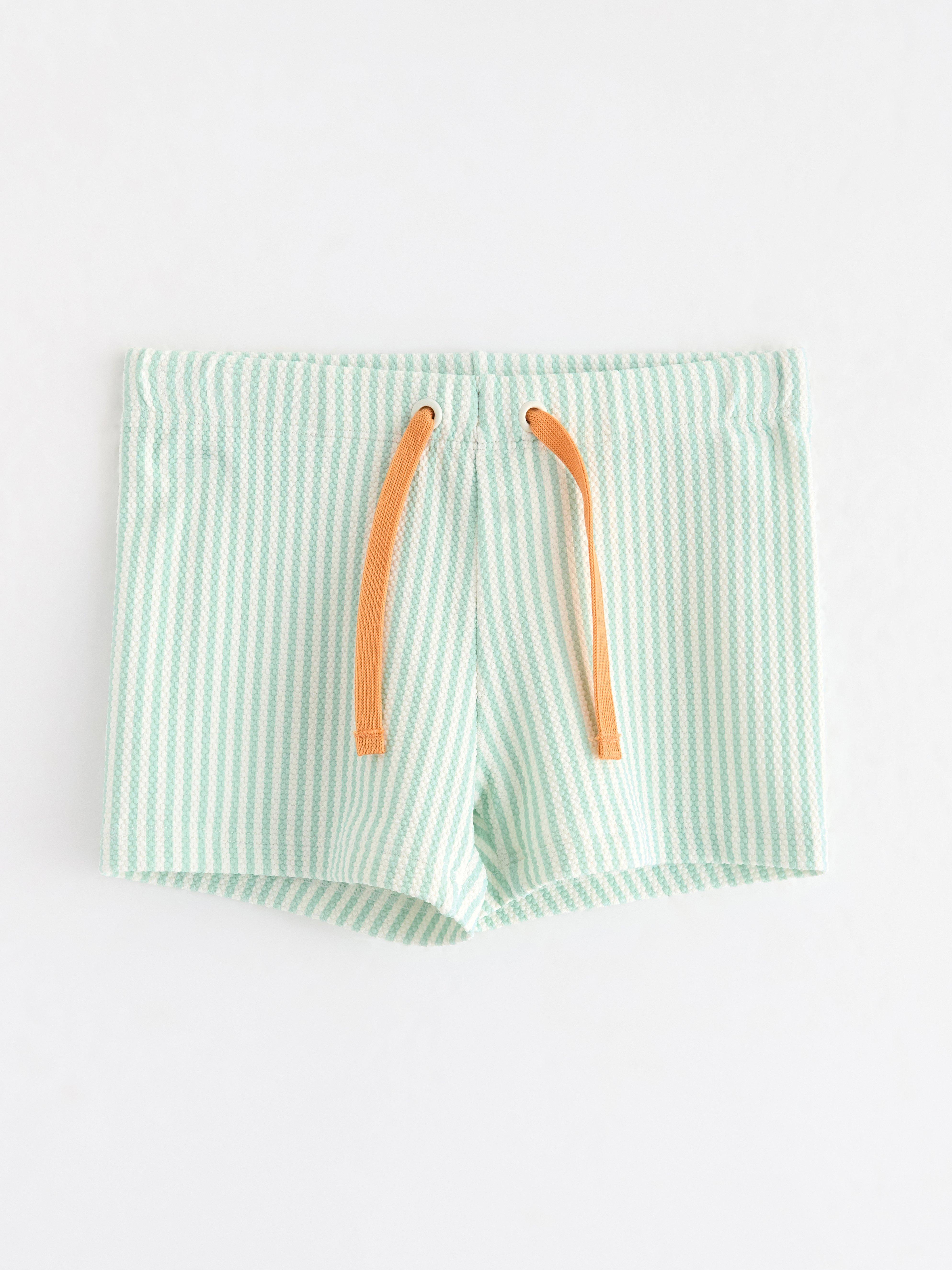Badbyxor med krinklad struktur Light Dusty Turquoise