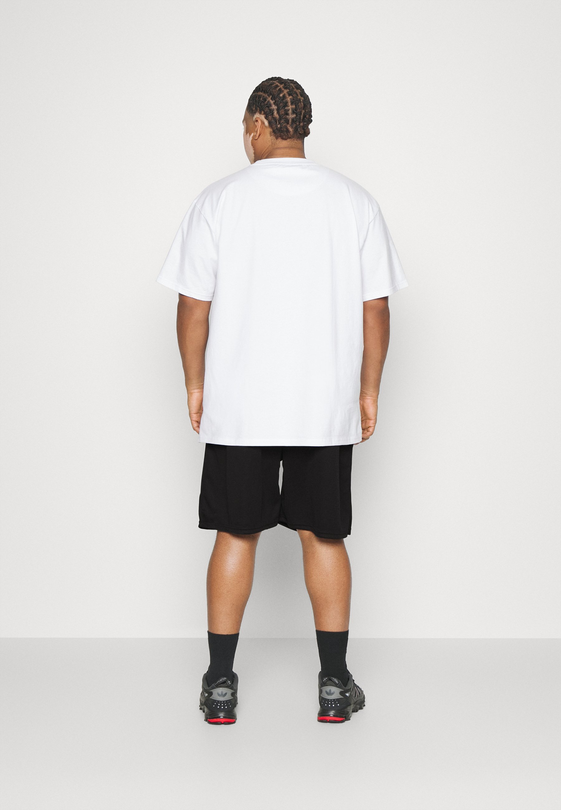 Pantaloni della tuta Karl Kani SMALL SIGNATURE - neri
