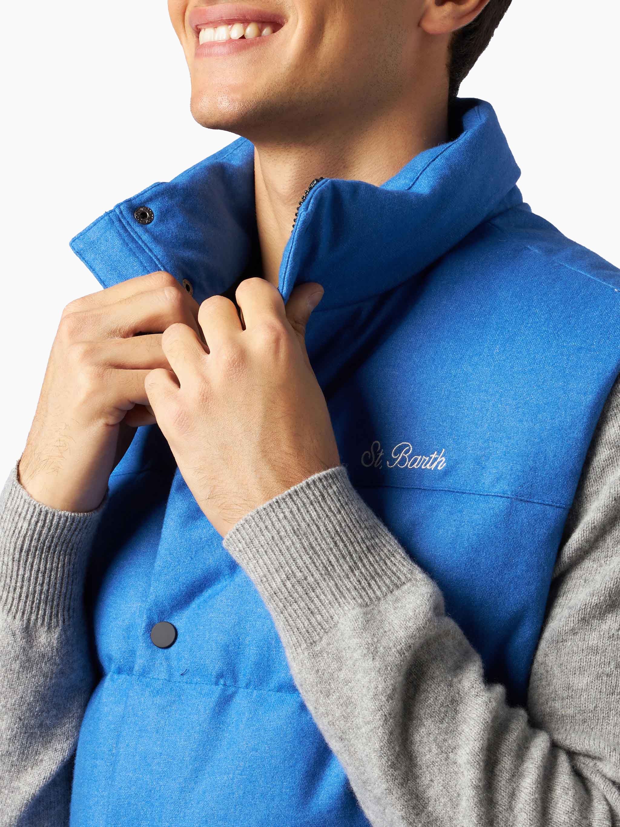 Herenvest, gevoerd met blauwe wollen dons en met zakken.