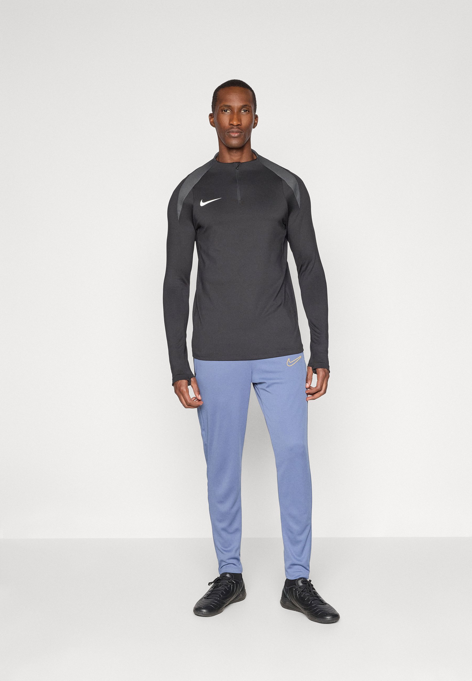 Spodnie dresowe Nike Performance ACADEMY PANT - rozproszony niebieski/złoty uniwersytecki
