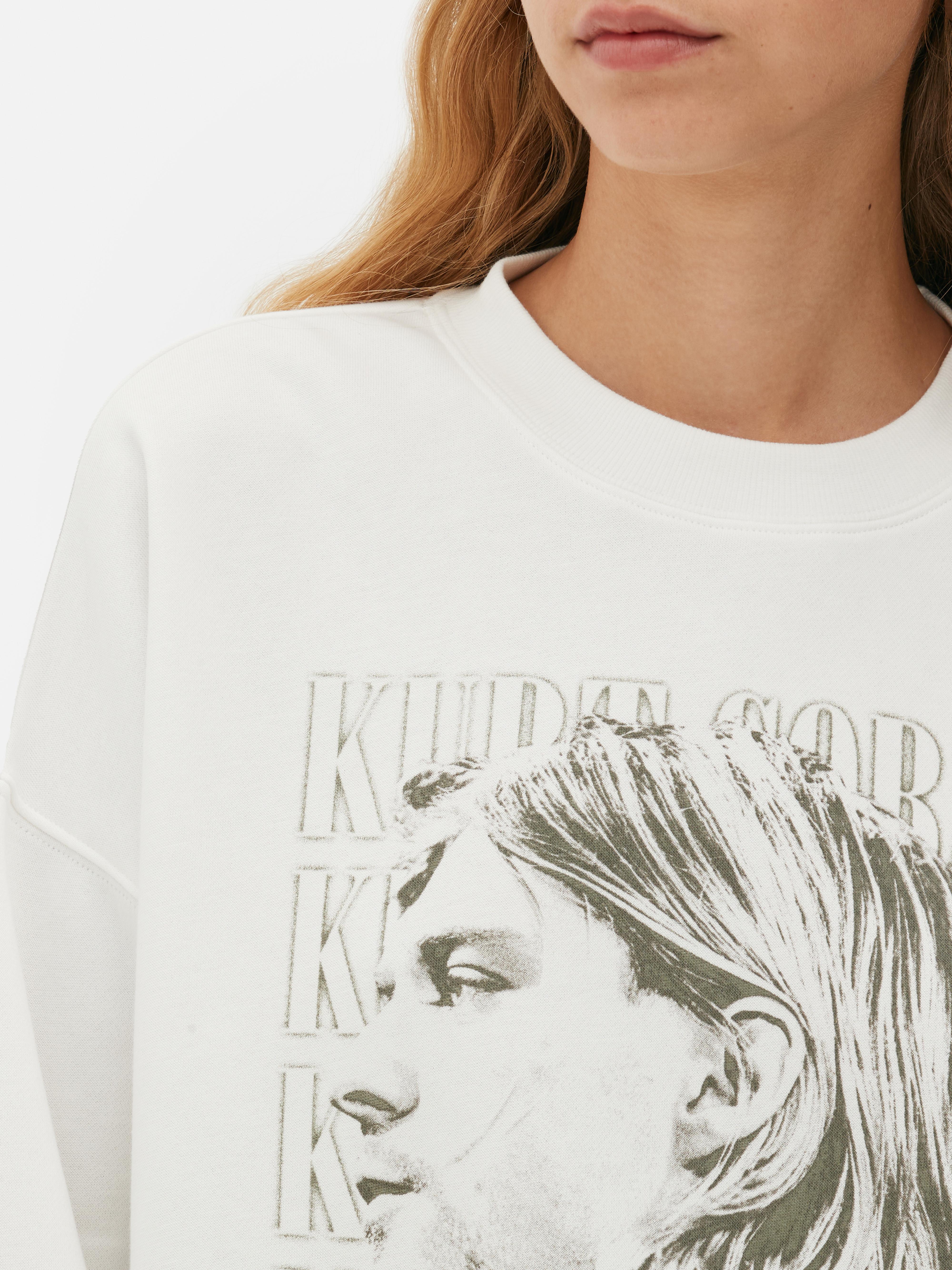 Hanorac cu imprimeu Kurt Cobain. Acest hanorac cu guler rotund Kurt Cobain aduce la viață era grunge.