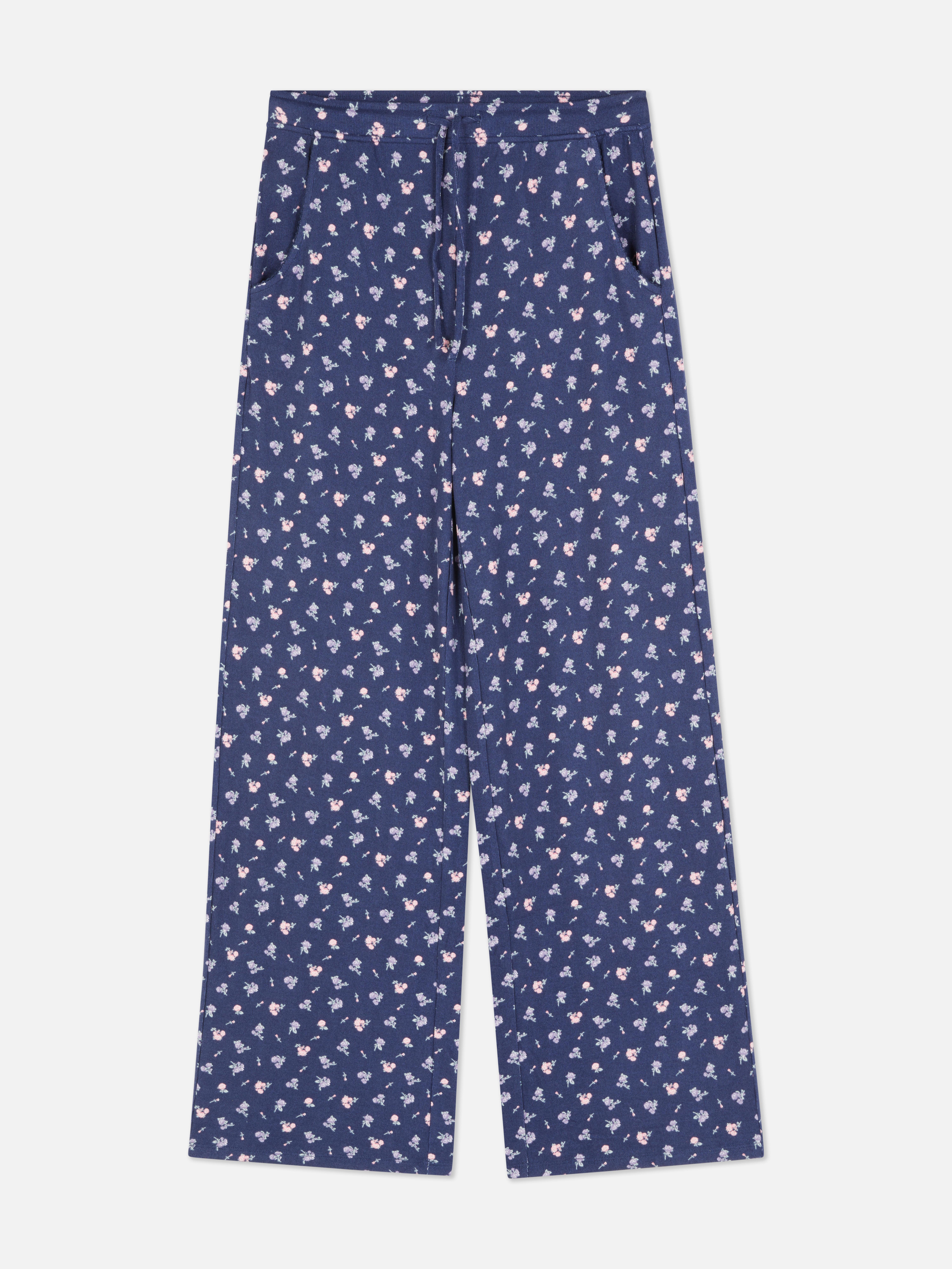 Pantaloni de pijama tricotați cu flori. Pantaloni de pijama cu model floral, șnur în talie și buzunare laterale.