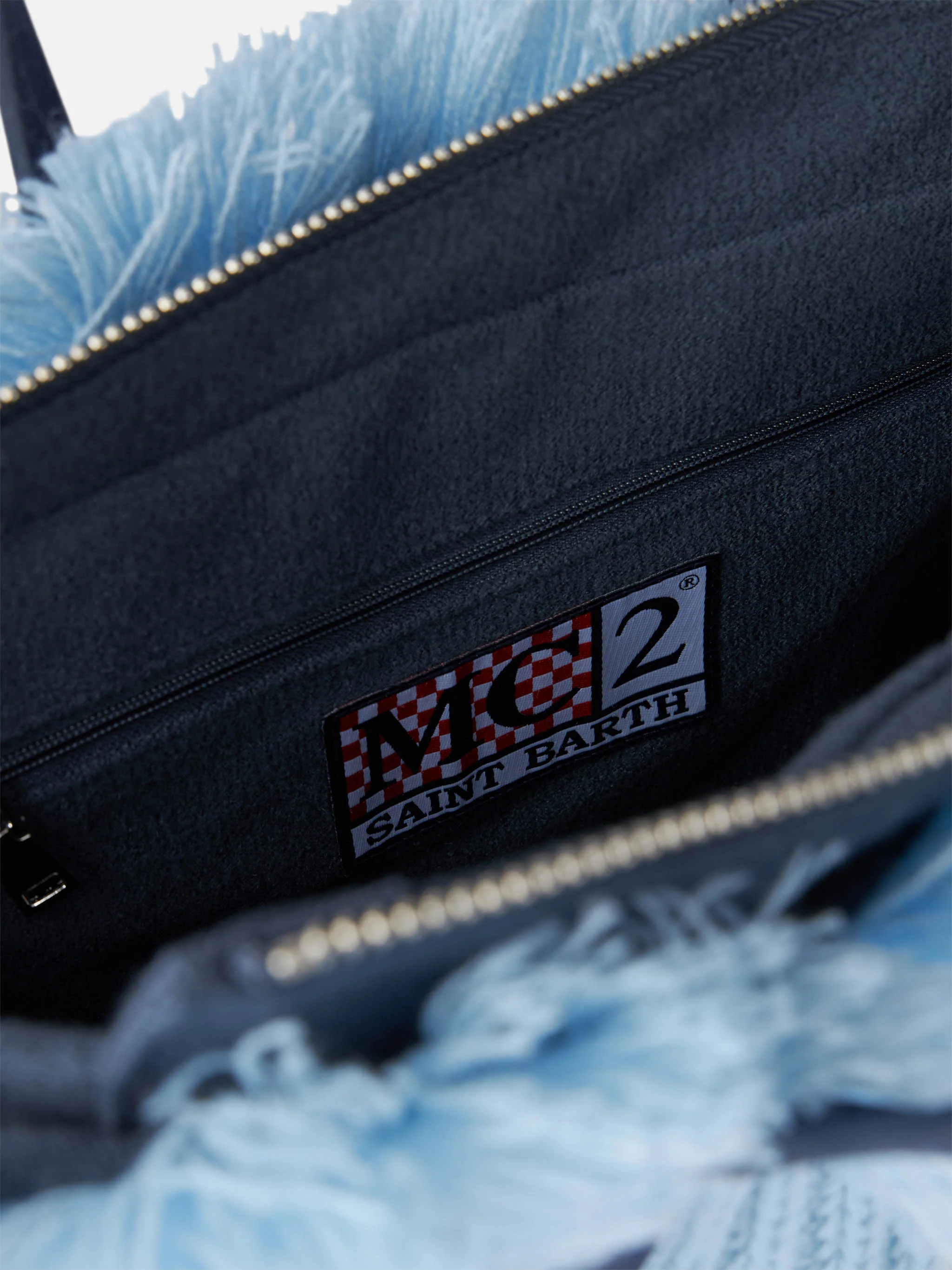 Colette tas van blauwe ribgebreide stof met logo-borduurwerk