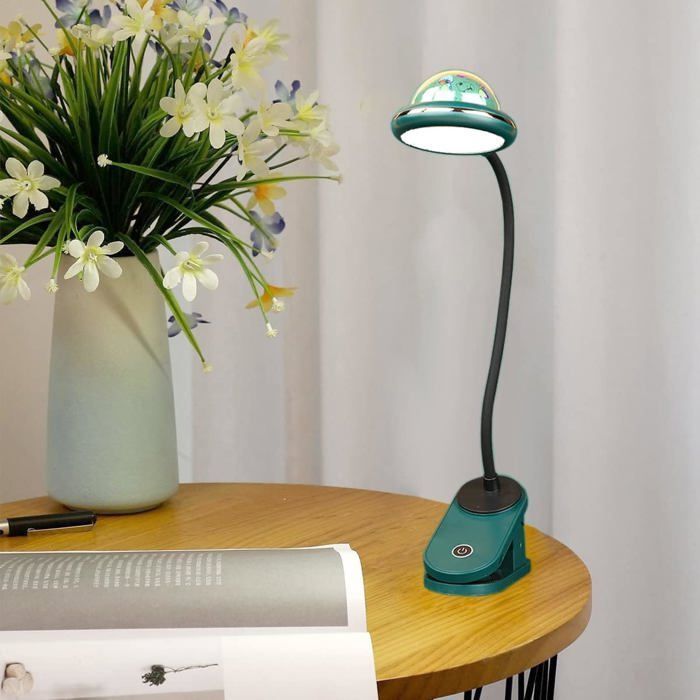Lámpara infantil con pinza, lámpara de lectura LED recargable por USB con proyección de estrellas e intensidad regulable mediante tacto.