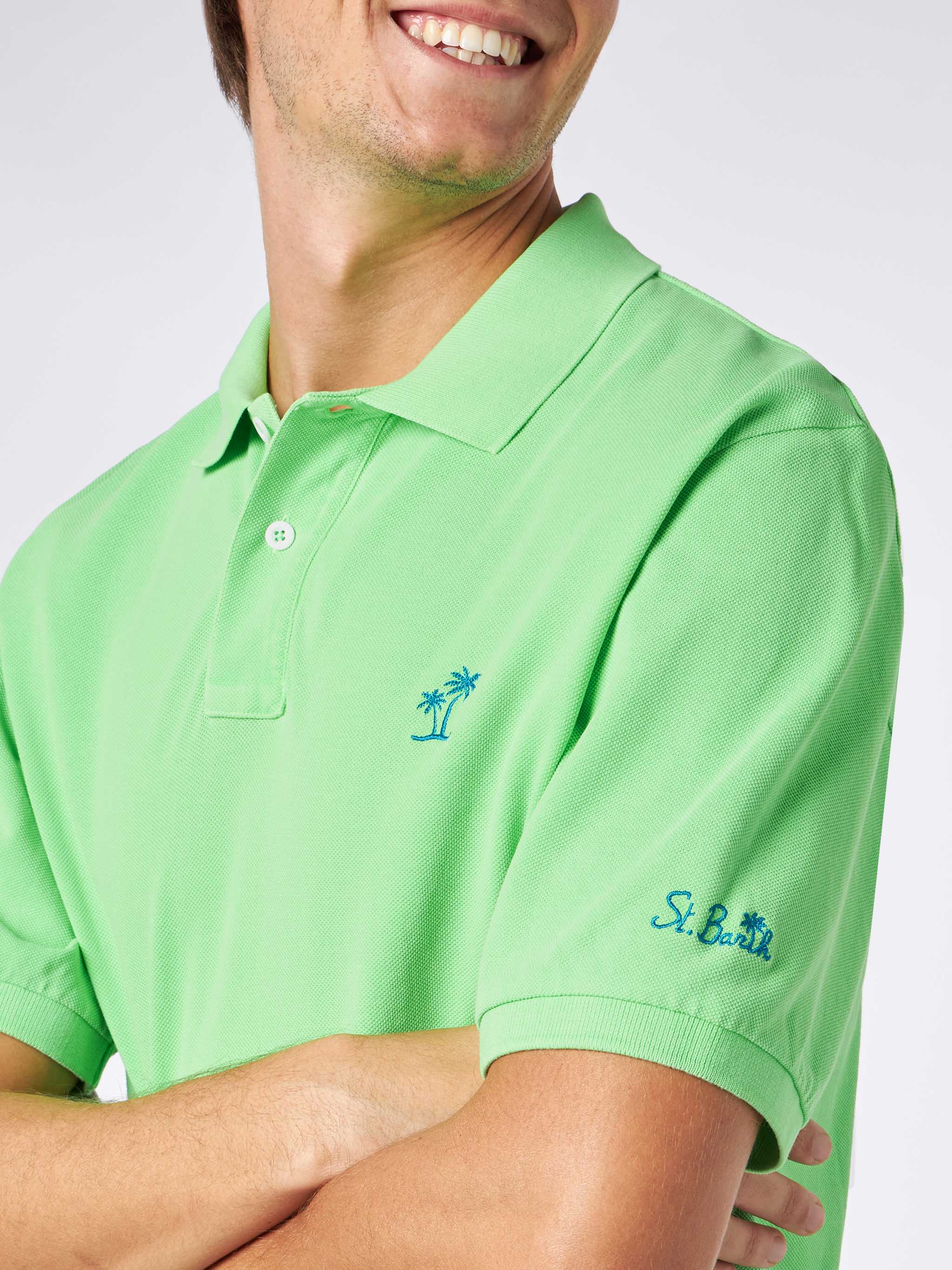 Polo da uomo in piquet verde fluo con logo St. Barth ed effetto vintag