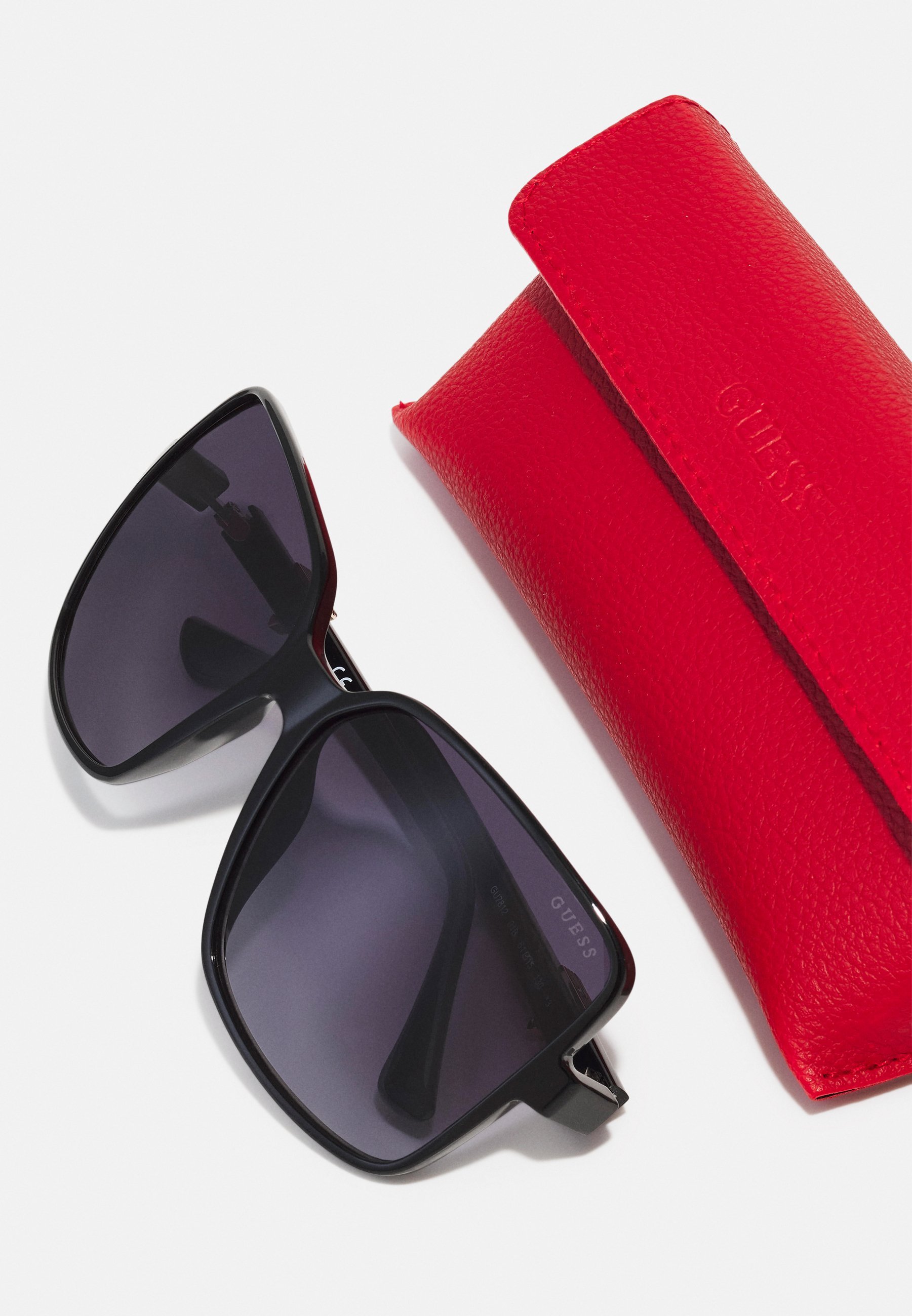Lunettes de soleil Guess - noires