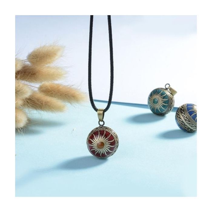 Pregnancy bola with sun motif