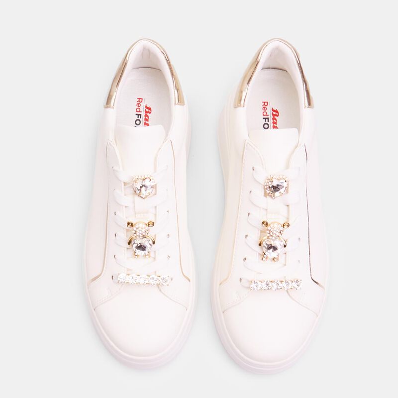 Damsneakers med snörning och juvelapplikationer