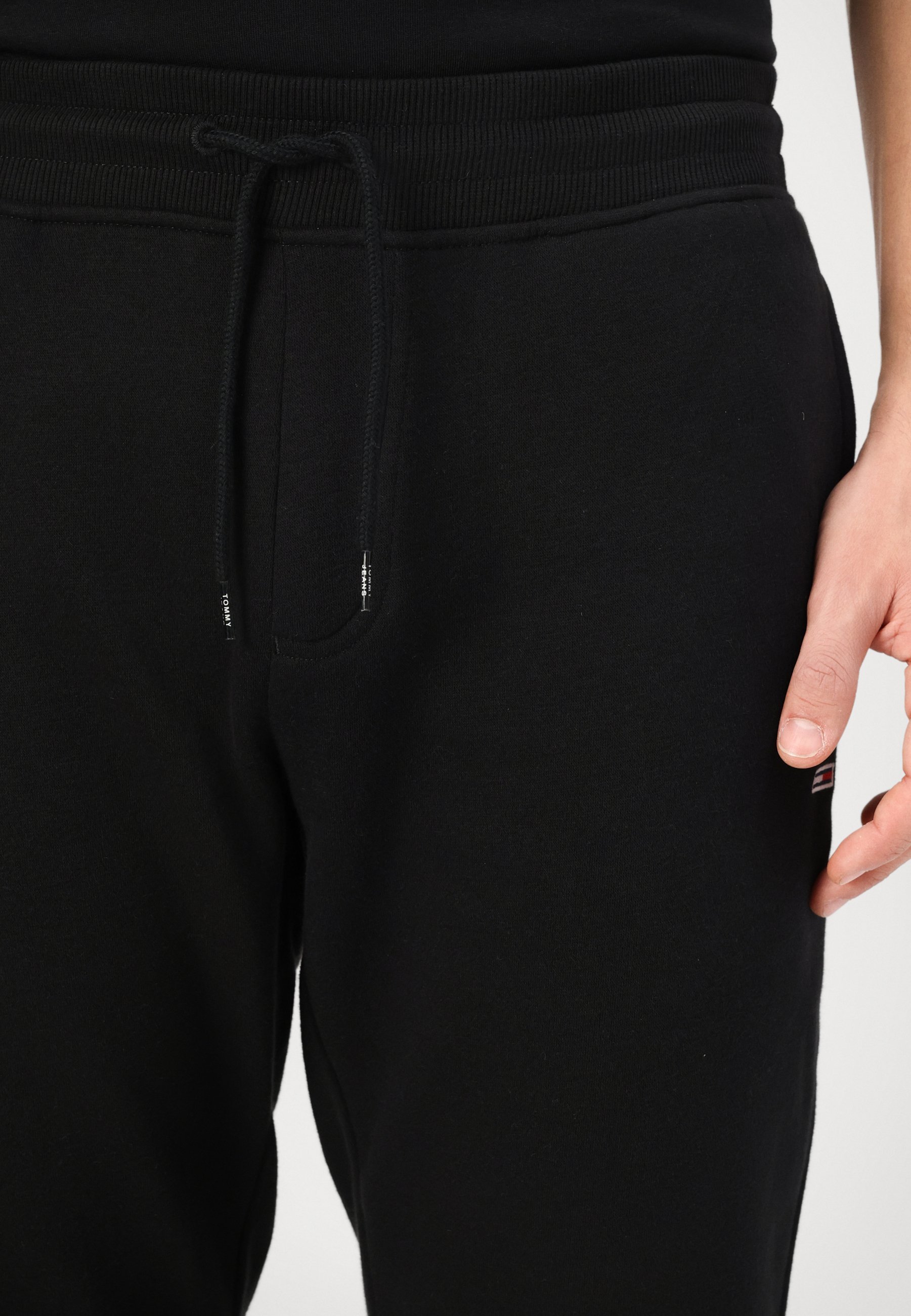Tommy Jeans TJM SLIM S FLAG - Trainingshose - schwarz