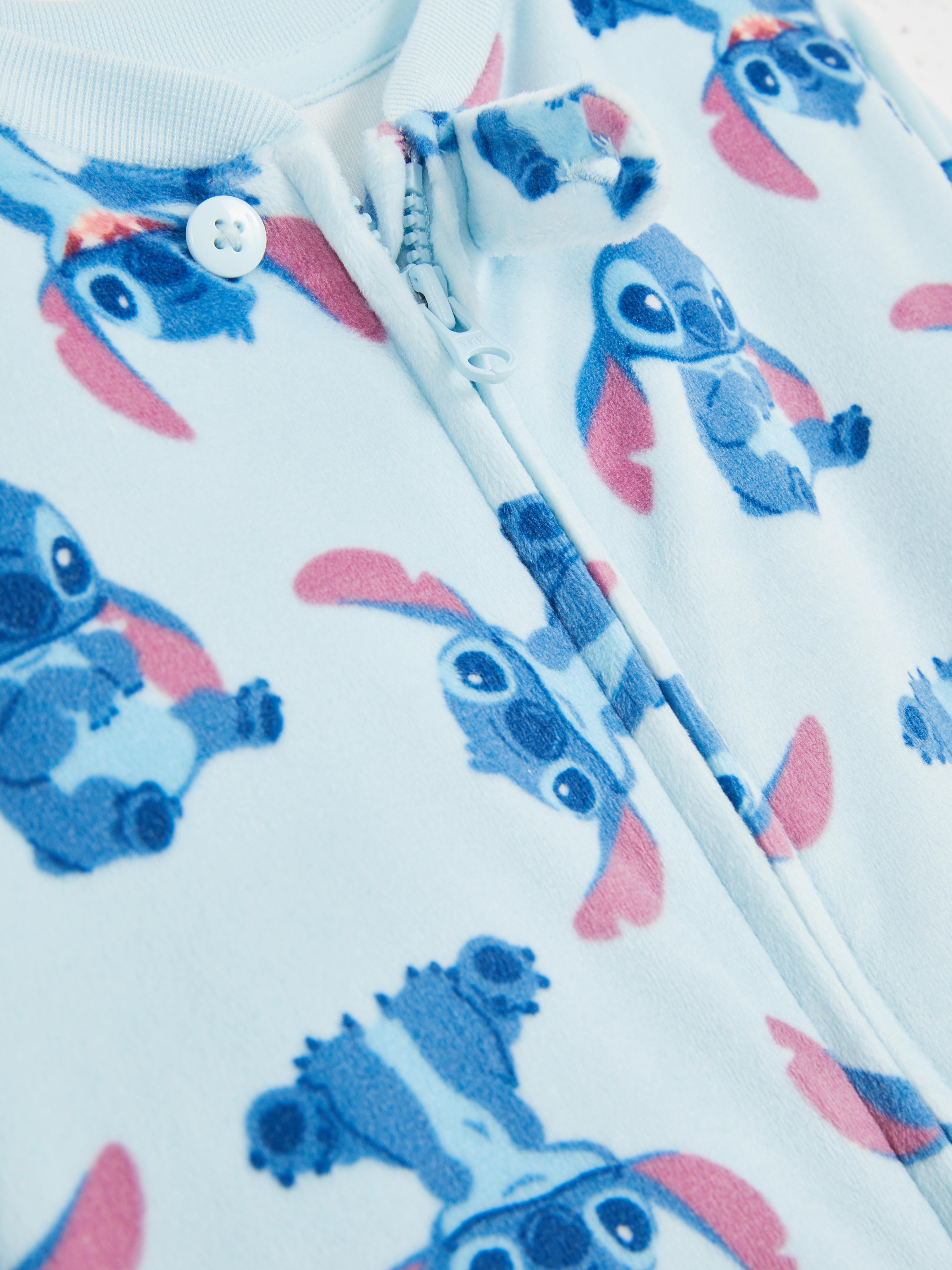 Salopetă cu fermoar Disney's Stitch O salopetă albastru deschis cu fermoar convenabil și Disney's Stitch