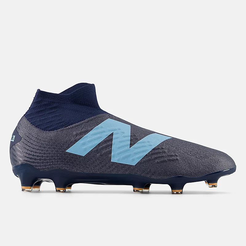Chuteira unissex TEKELA MAGIA FG V4+ - Azul Marinho NB com detalhes em Azul Celeste e Manga Vibrante