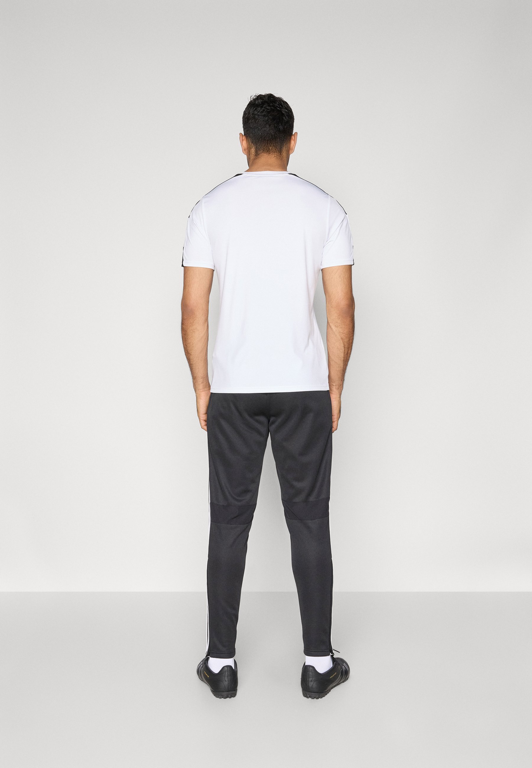 Pantaloni da allenamento invernali adidas Performance TIRO25 ESSENTIALS - Pantaloni della tuta - nero/bianco