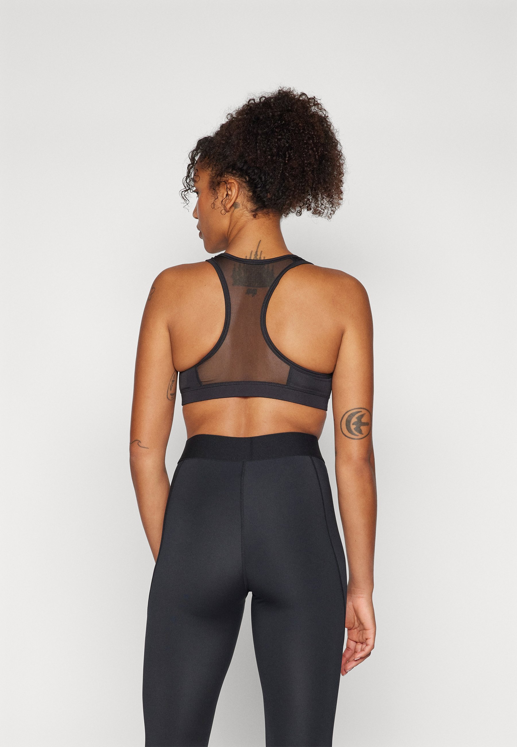 Puma BRA - Sportbeha met gemiddelde ondersteuning - zwart
