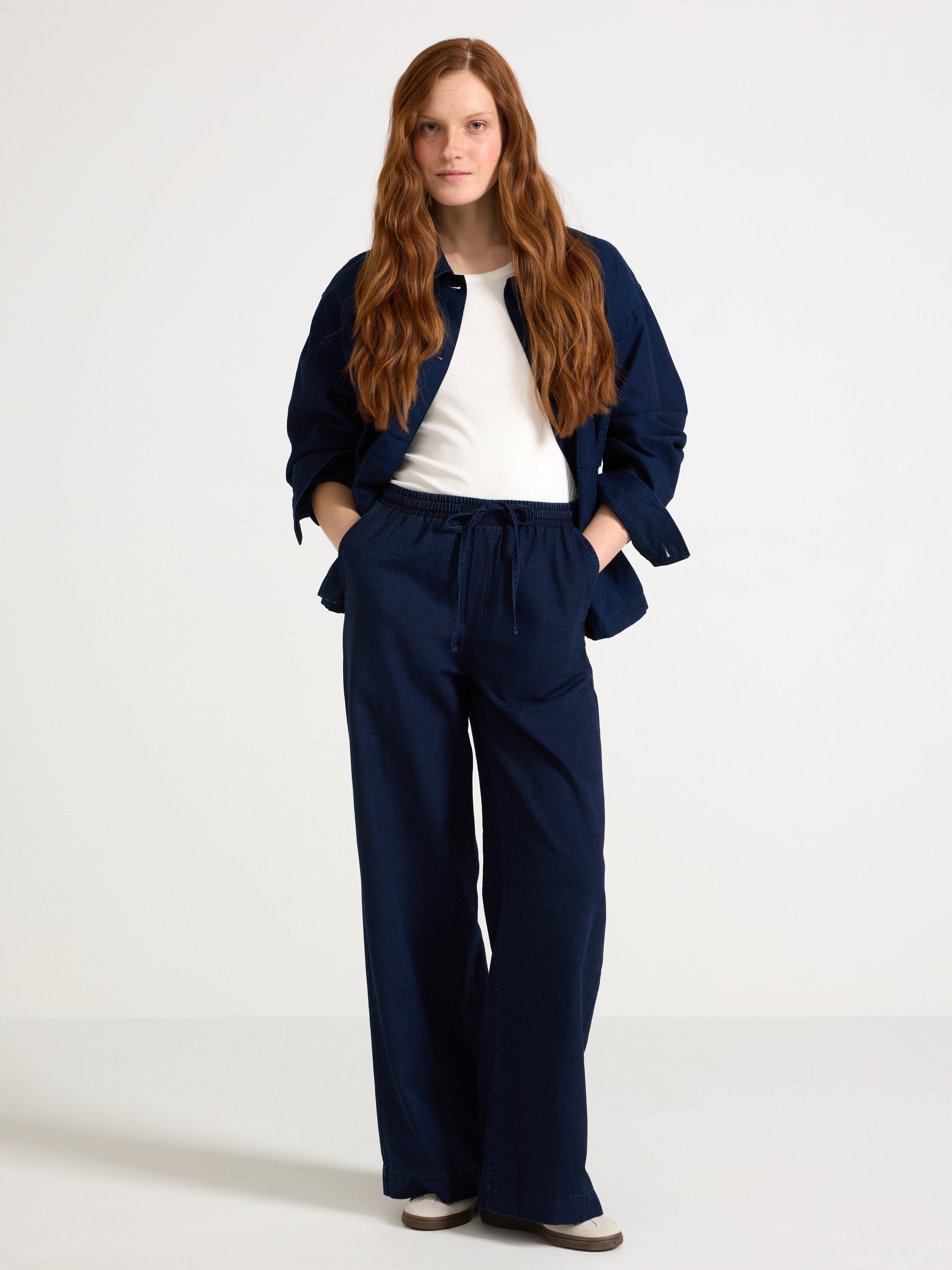 Pantalones vaqueros con cordón ajustable, color azul vaquero.