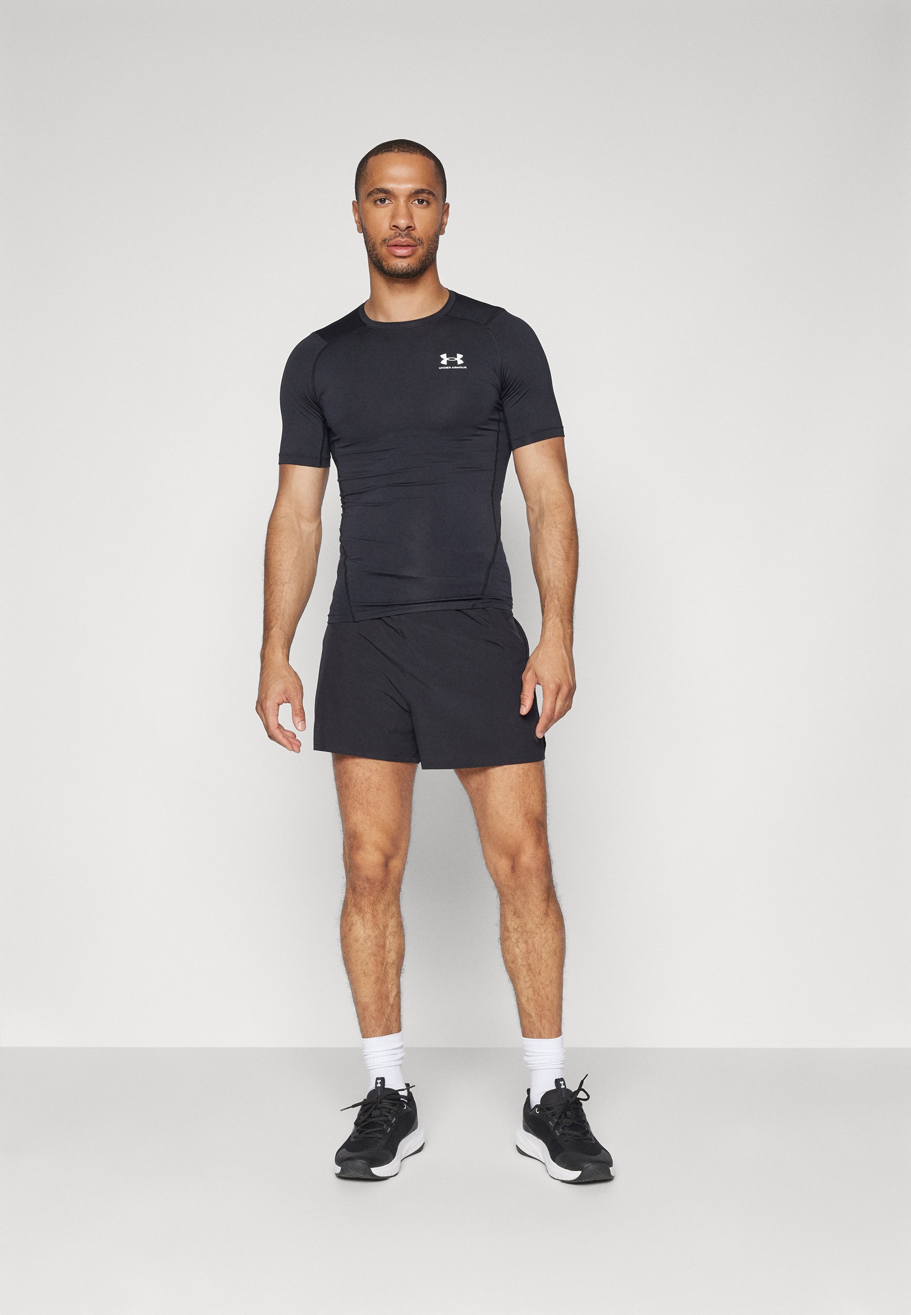 Under Armour HEATGEAR - T-shirt sportiva - nero/bianco