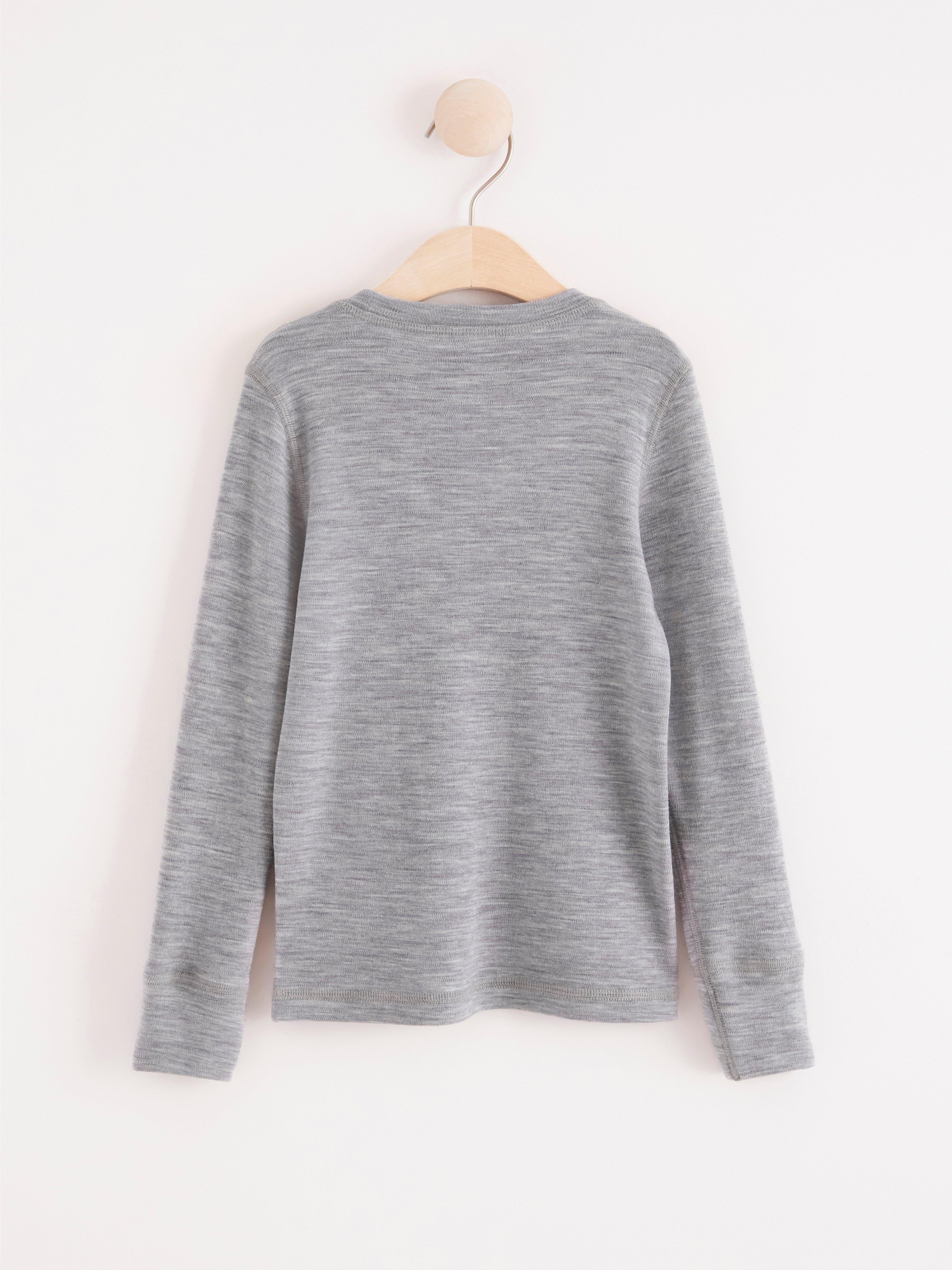 Top a maniche lunghe in lana merino grigio mélange