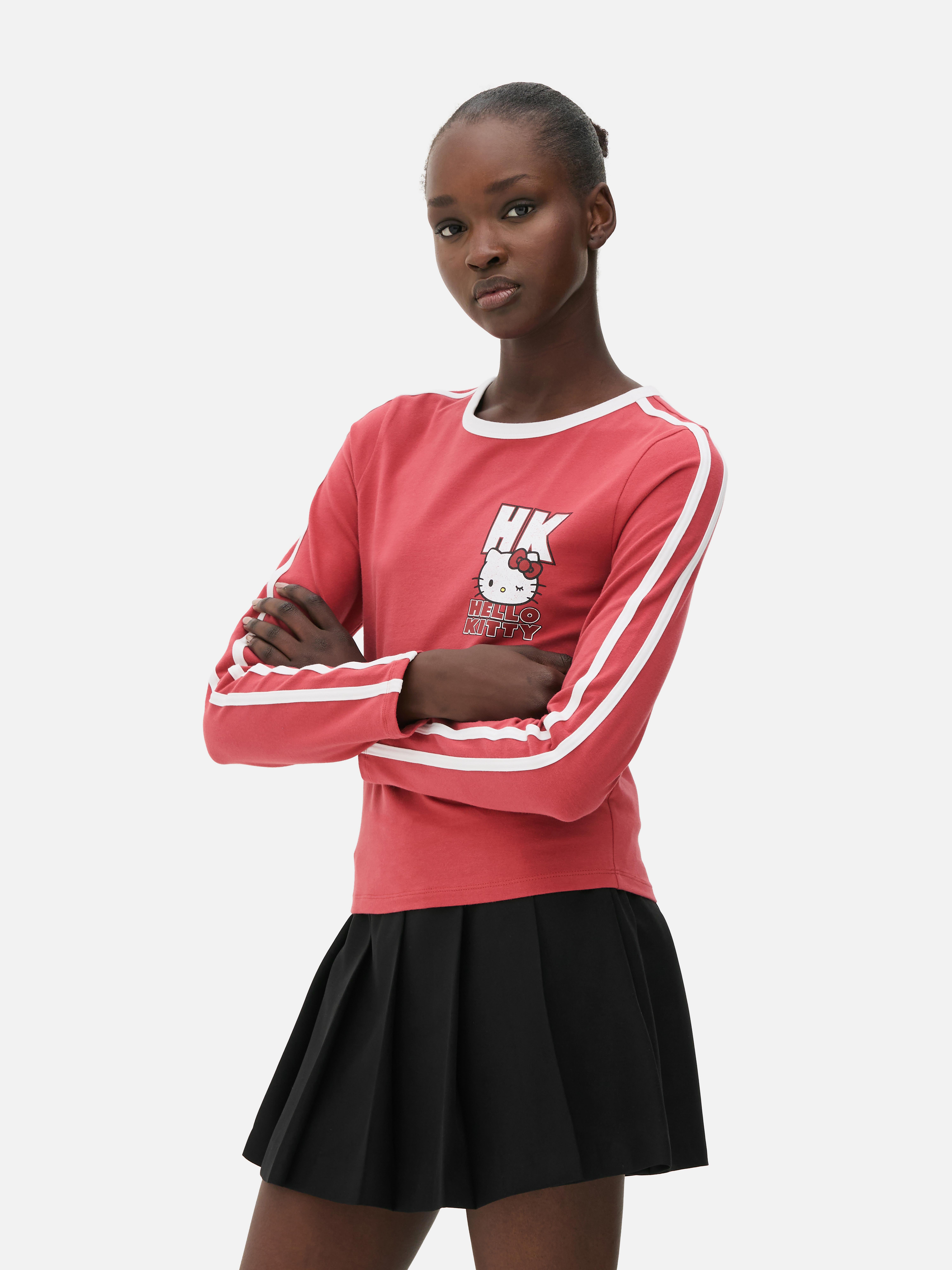 Tricou cu mânecă lungă Hello Kitty Un tricou cu guler rotund, mâneci lungi, dungi sport și logo Hello Kitty