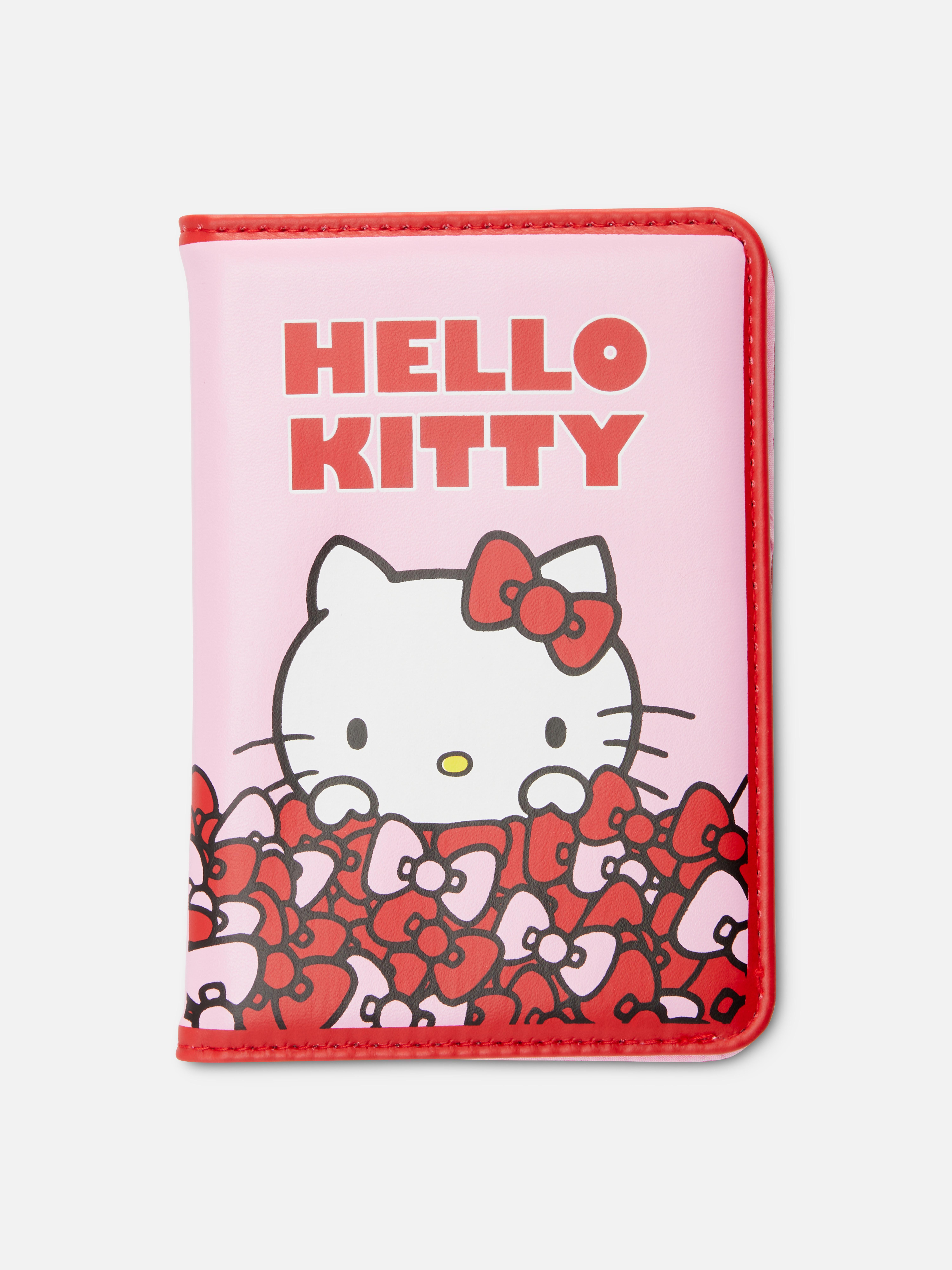 Hello Kitty 50. évfordulós útlevélborító. Ez a Hello Kitty útlevéltartó készen áll a repülésre, a forgatásra és az indulásra.