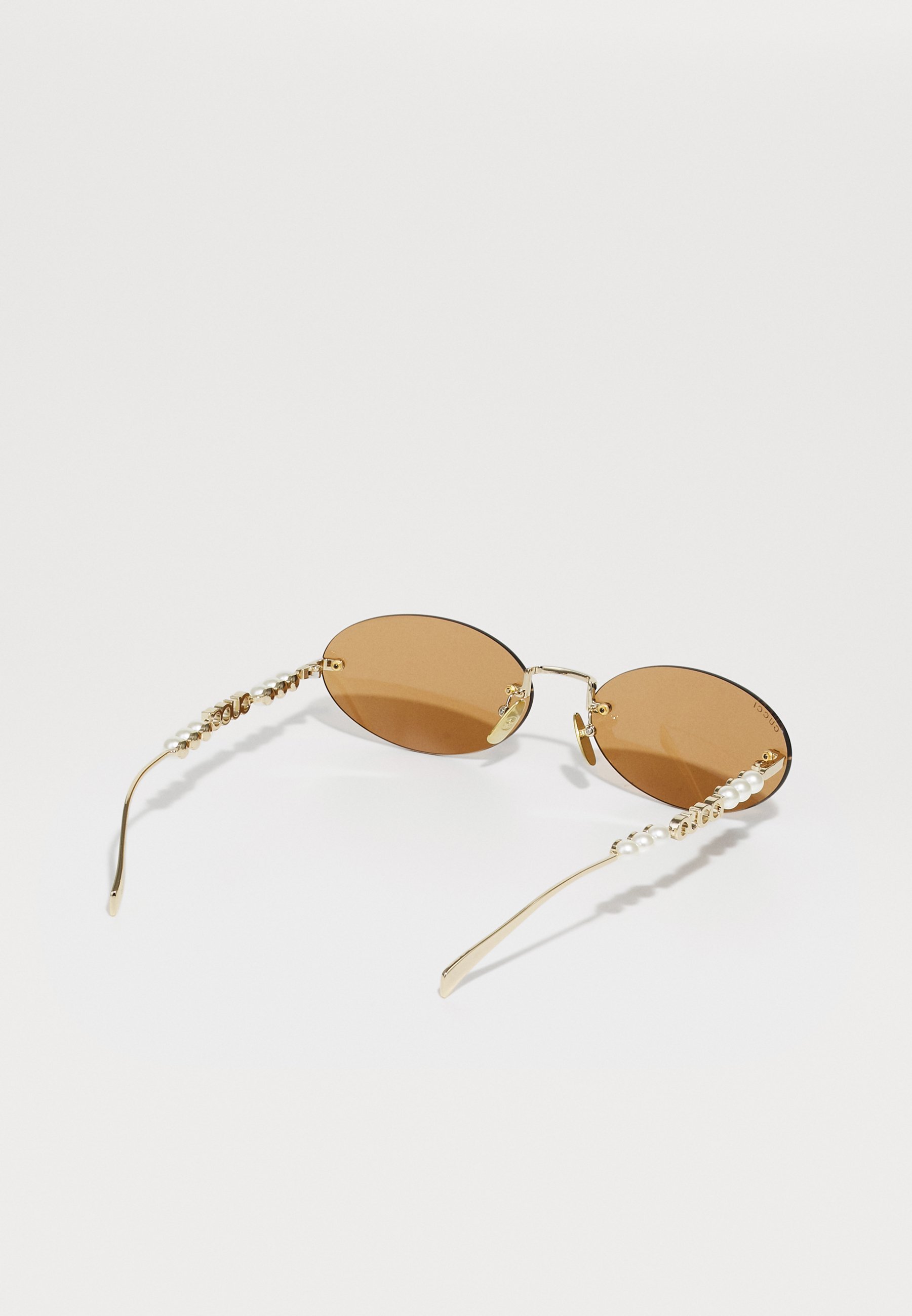 Lunettes de soleil Gucci - couleur or/marron