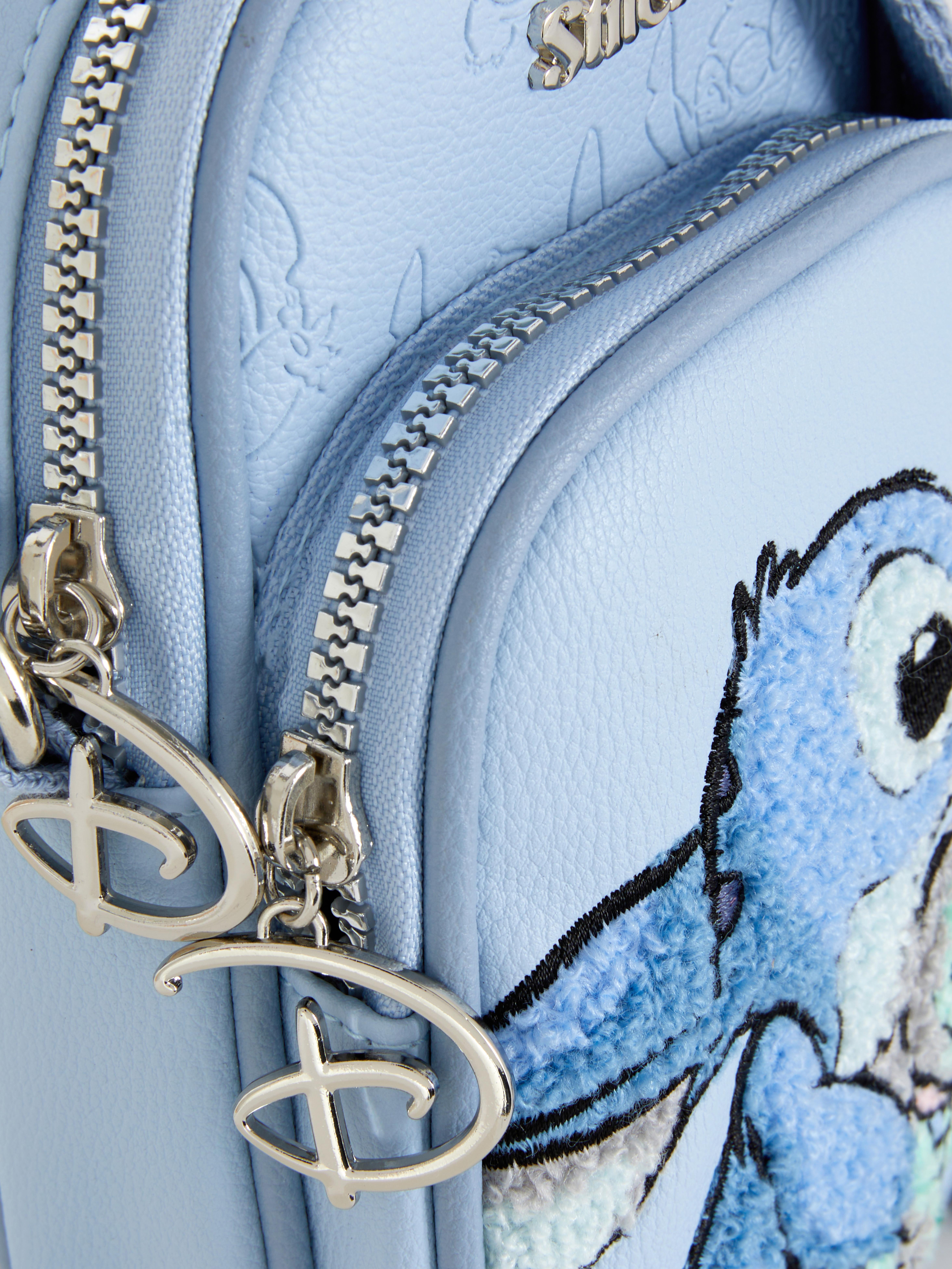 Geantă de umăr din piele ecologică Disney Stitch. O geantă de umăr albastră Stitch cu curea reglabilă și două compartimente.