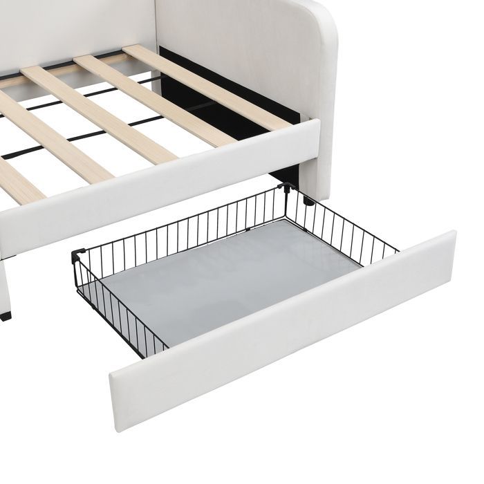 Cama infantil de 90x200 cm tapizada en terciopelo blanco con 2 cajones, 3 bolsillos laterales y somier de láminas metálicas, convertible en cama para padres e hijos.