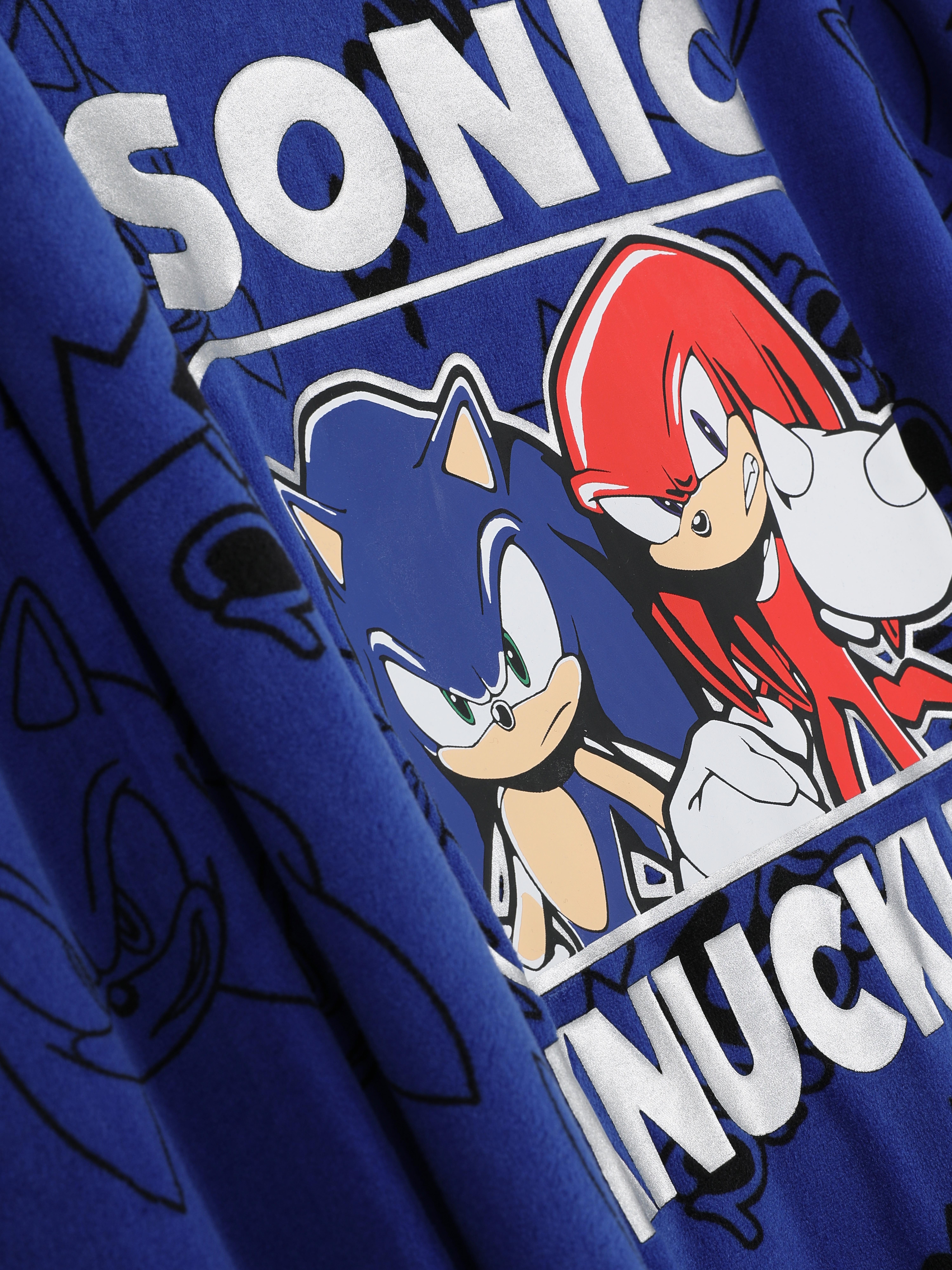 Tricou și pantaloni de pijama cu Sonic Ariciul. Micul tău jucător se grăbește spre confortul de seară în aceste pijamale cu Sonic.