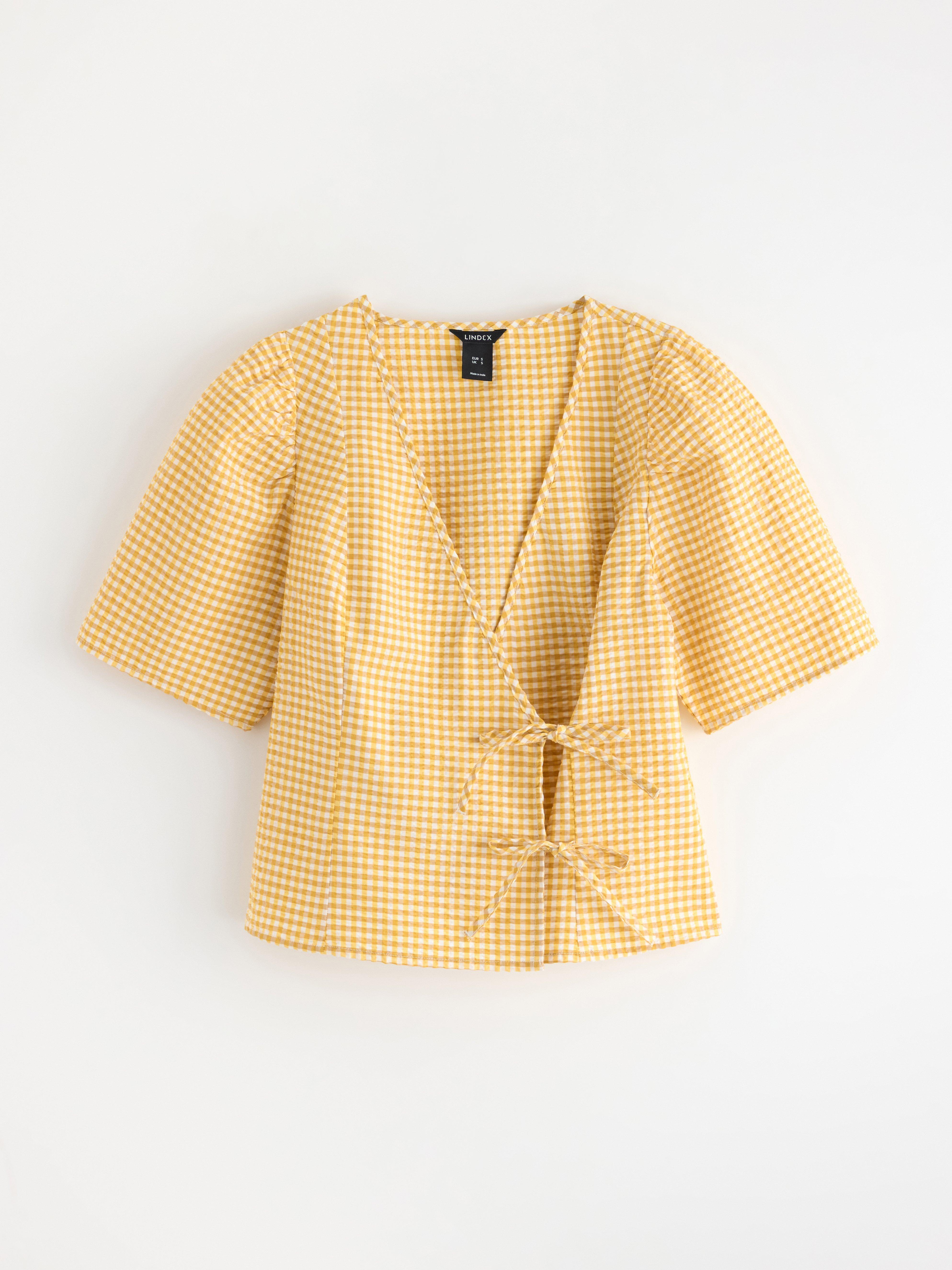Blusa con estampado de pelícanos amarillos