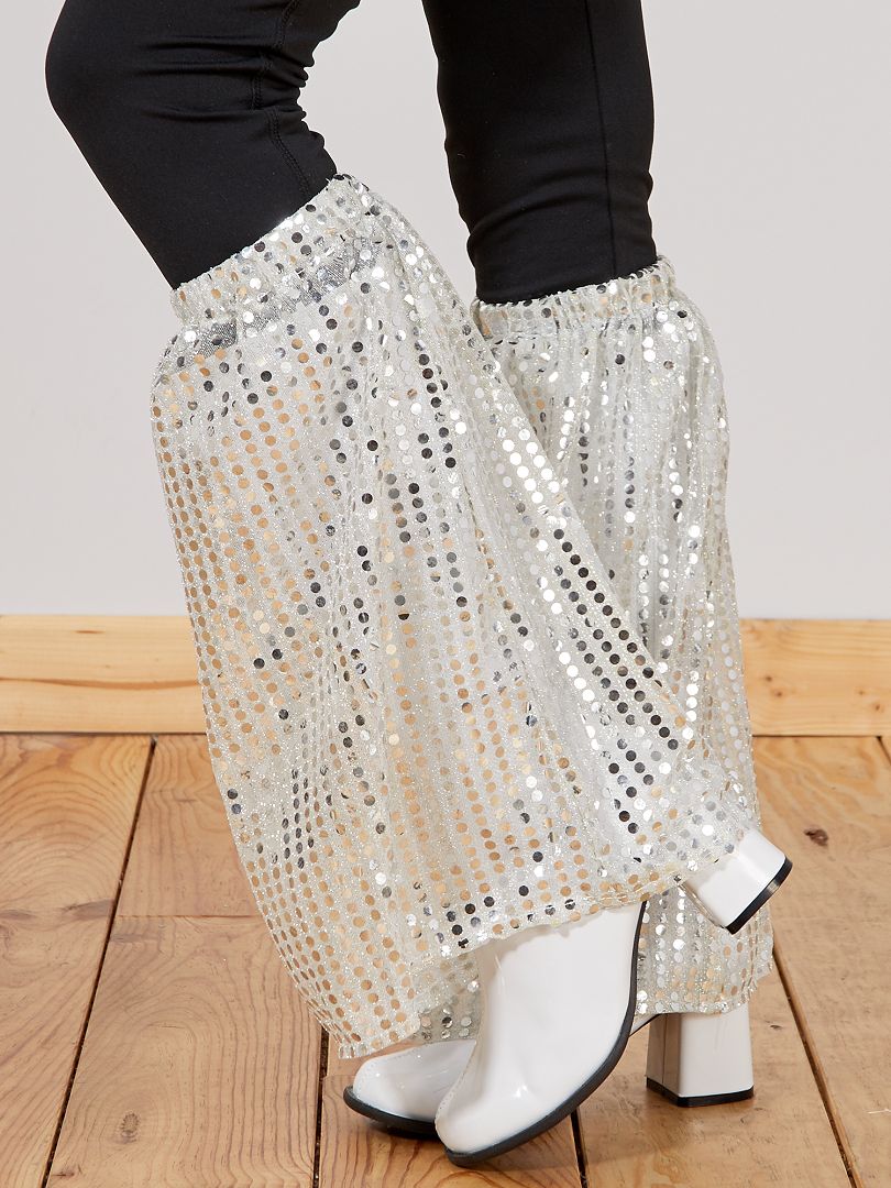 Leggings plateados con lentejuelas y estampado de piernas de elefante.