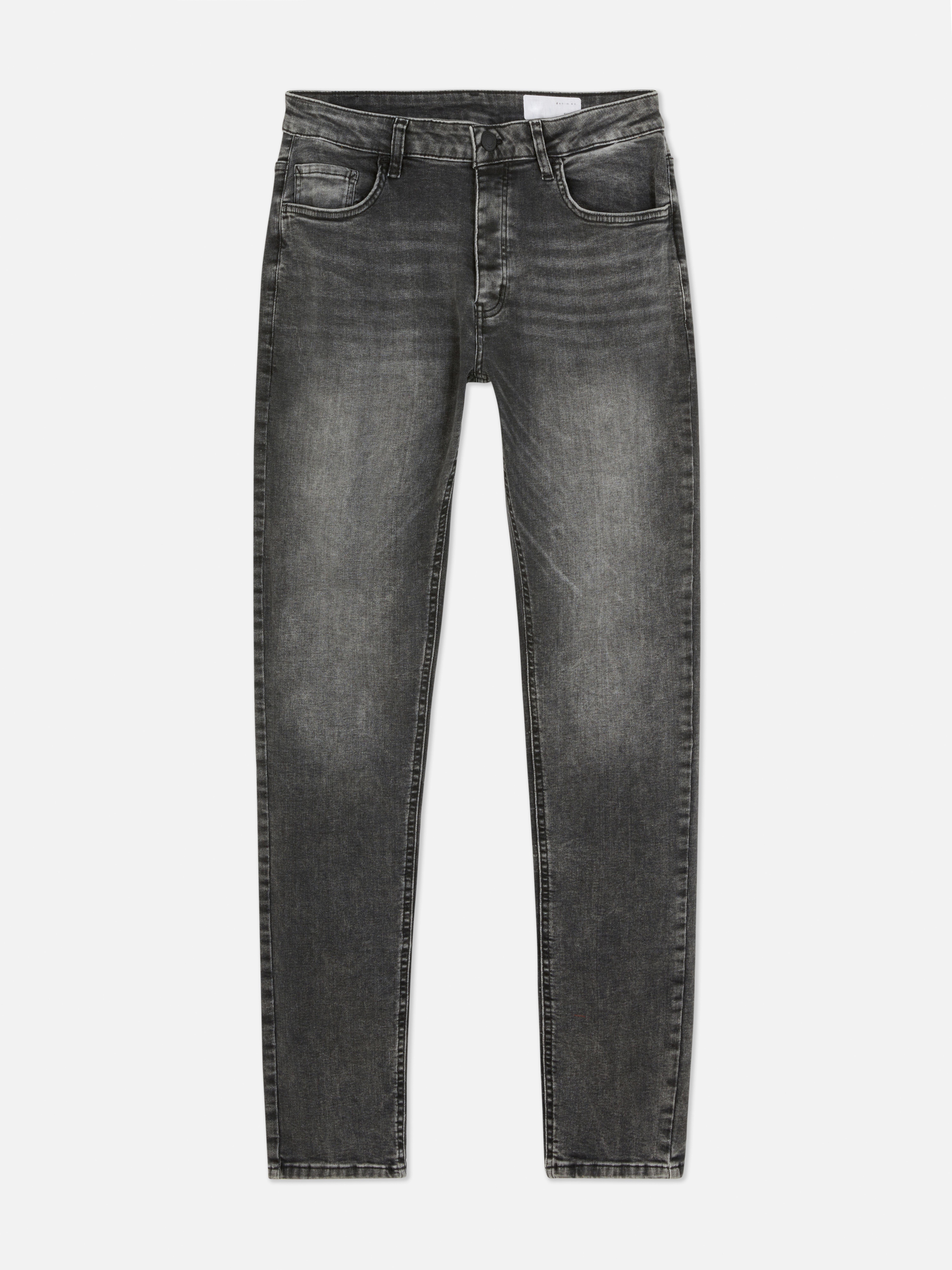 Blugi elastici, slim fit. Blugi mulați cu închidere cu nasturi, cinci buzunare și găici pentru curea.