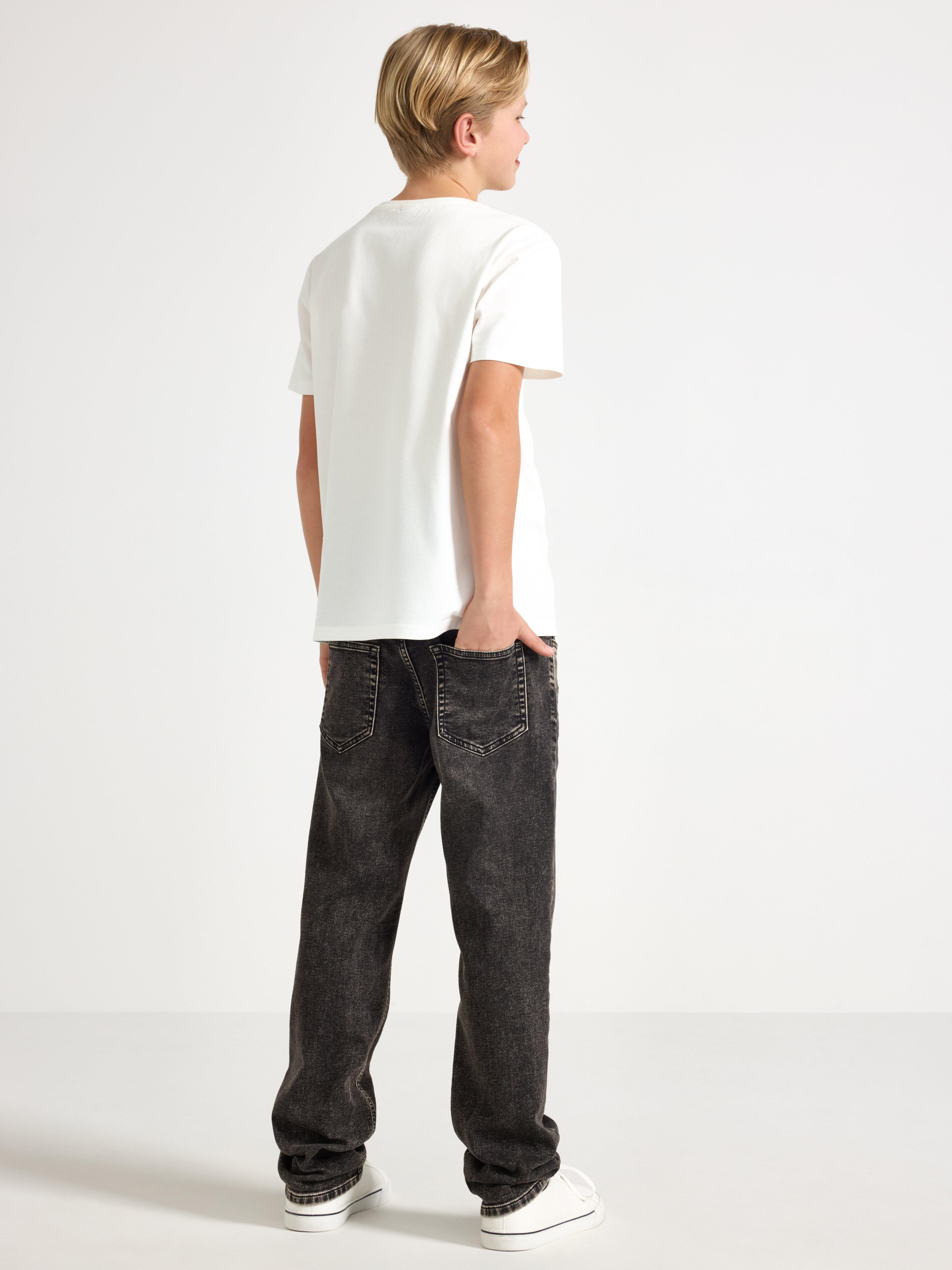 Pantalones vaqueros STAFFAN de punto súper elástico con pierna recta y cintura normal, color negro.