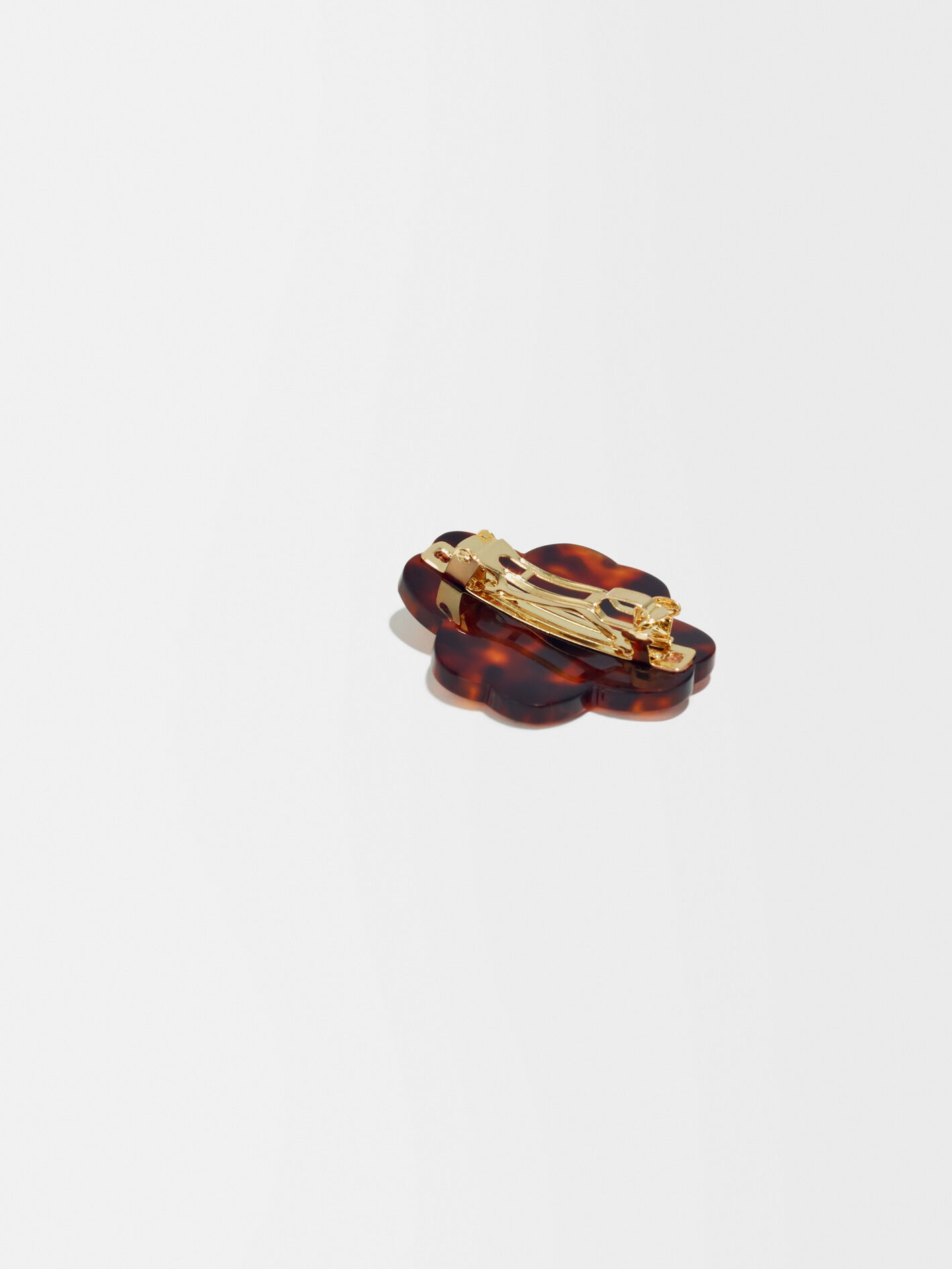 Amberkleurige broche met Clover-Dore-logo