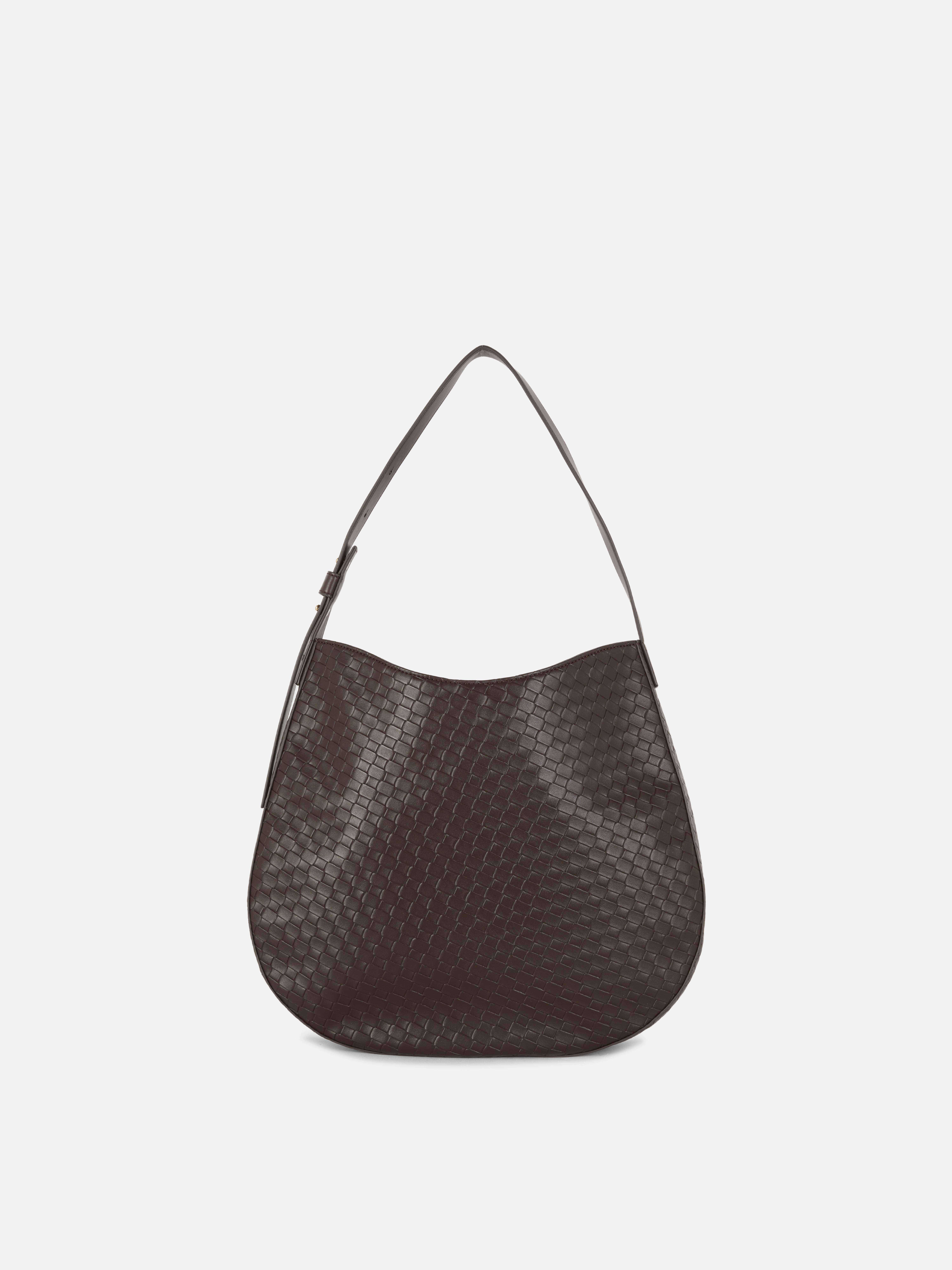 Geschmeidige, gewebte Shopper-Tasche von Paula Echevarría. Eine geräumige, gewebte Schultertasche mit geschmeidiger Form für den täglichen Gebrauch.
