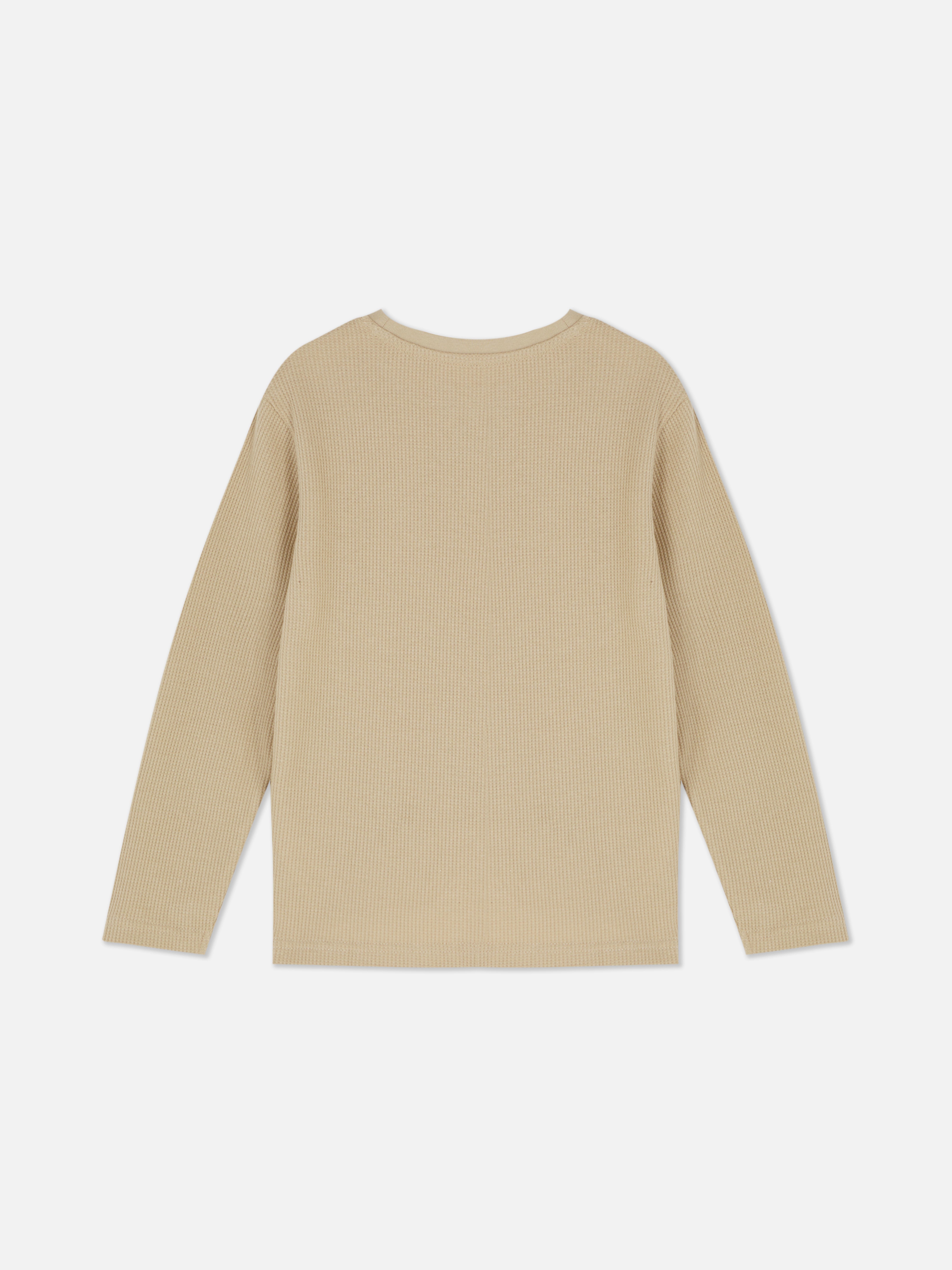Tricou cu textură waffle și mâneci lungi. Acest tricou texturat are decolteu rotund și mâneci lungi.