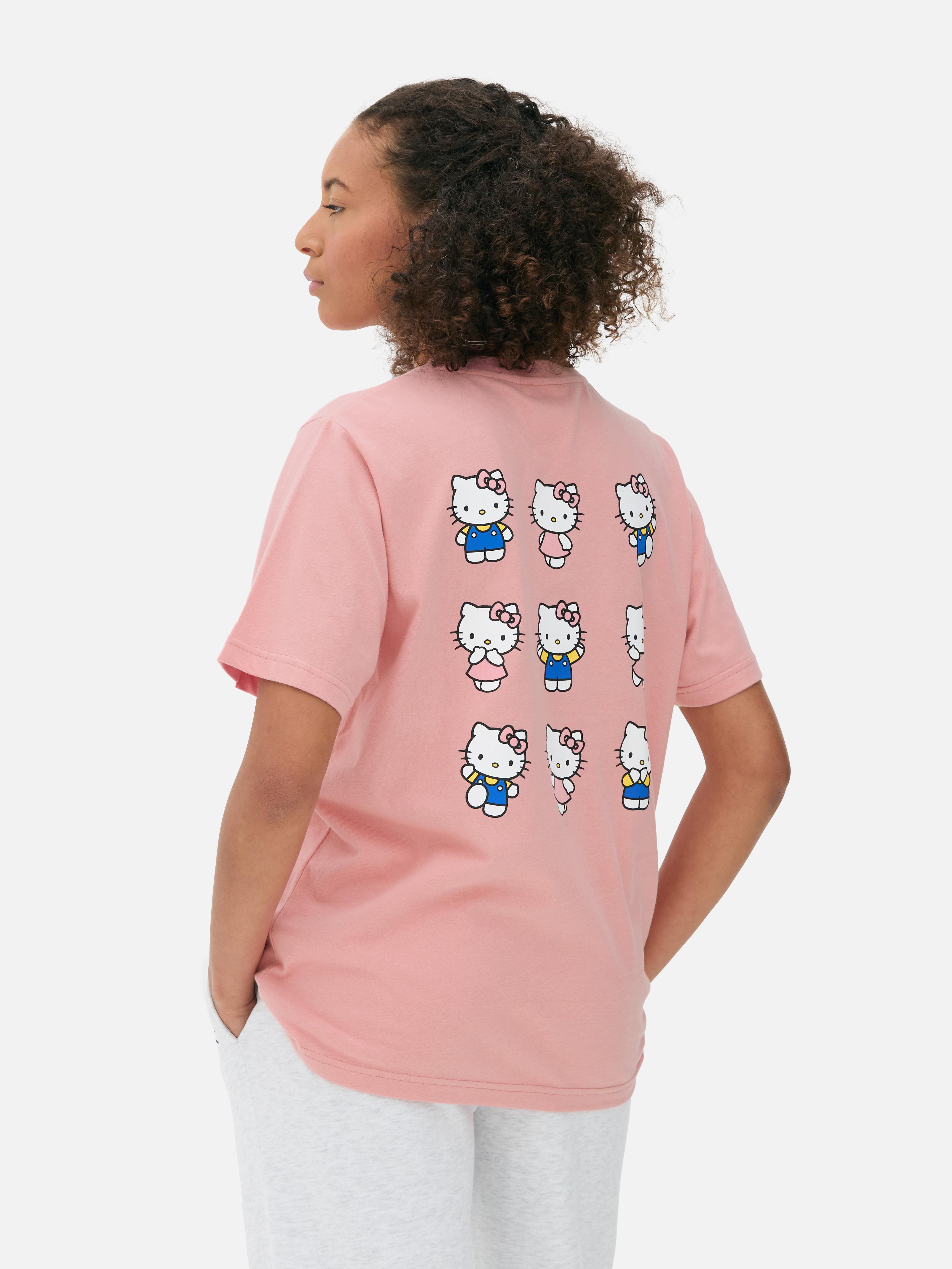 Tricou cu imprimeu Hello Kitty. Acest tricou supradimensionat cu Hello Kitty, cu decolteu rotund și mâneci scurte, este o piesă drăguță de bază.
