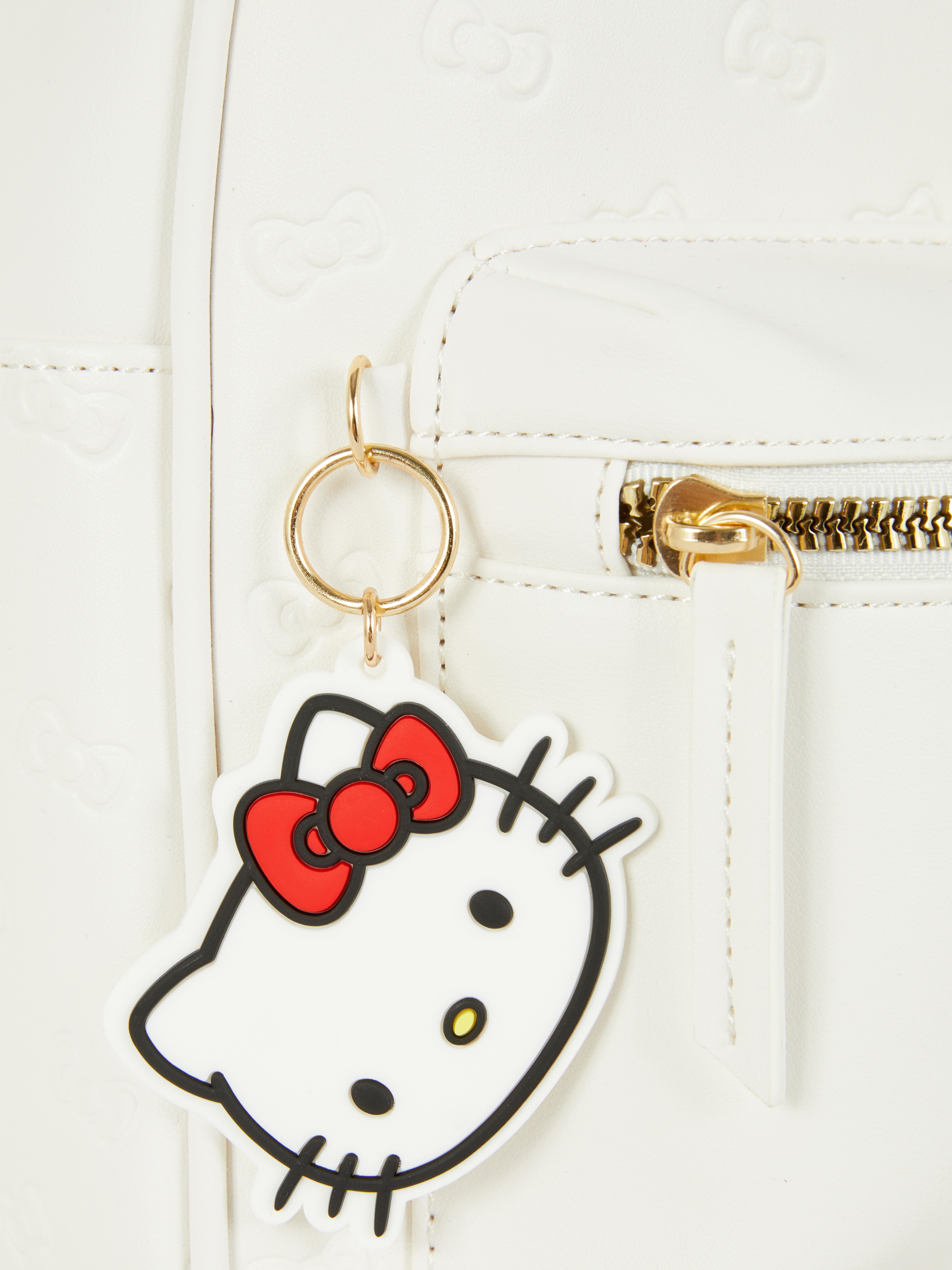 Ранац Hello Kitty Ранац са подесивим нараменицама, џеповима са затварачем, горњом ручком и ликовима Hello Kitty