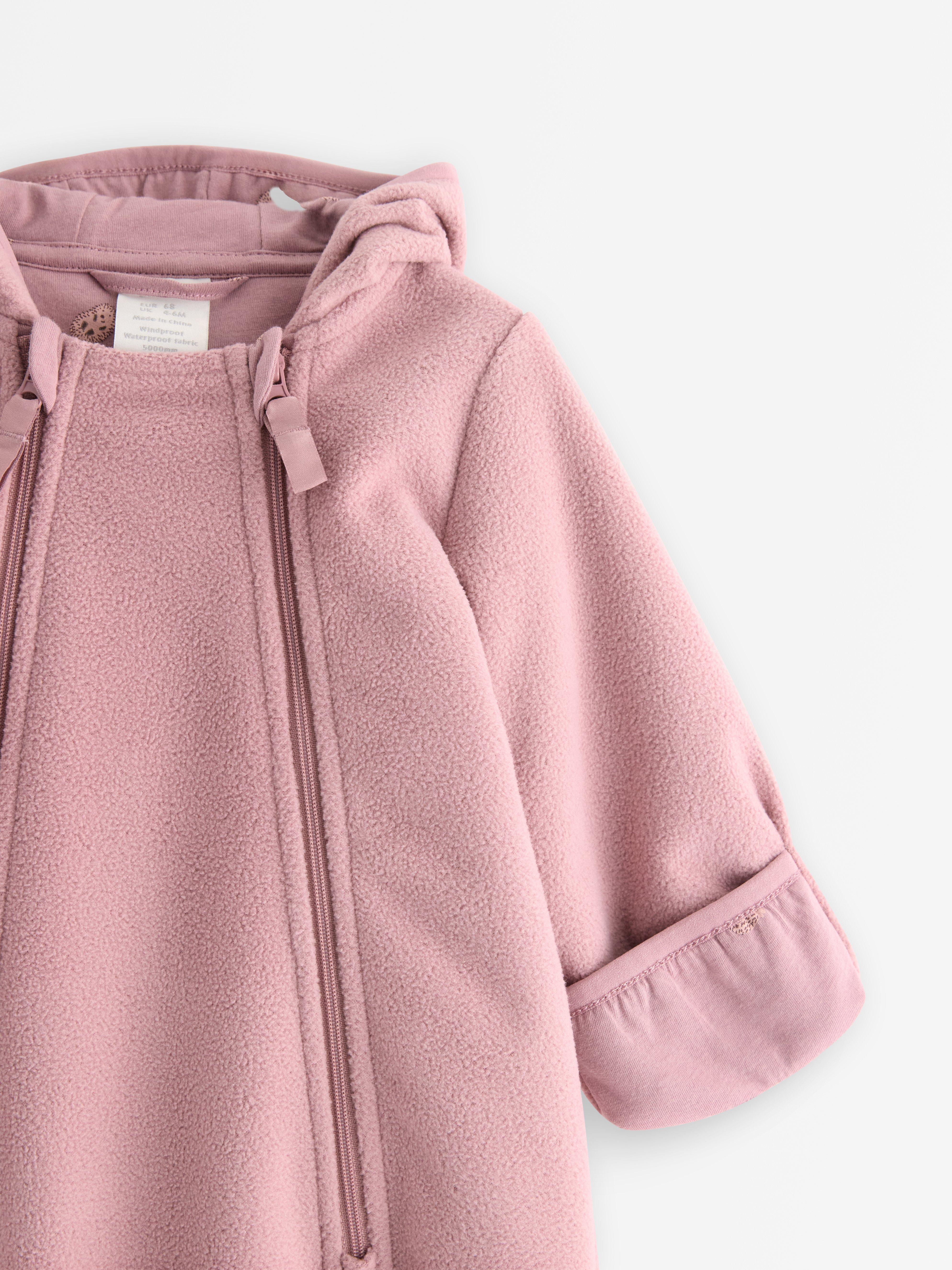 Combinaison en polaire rose poudré clair