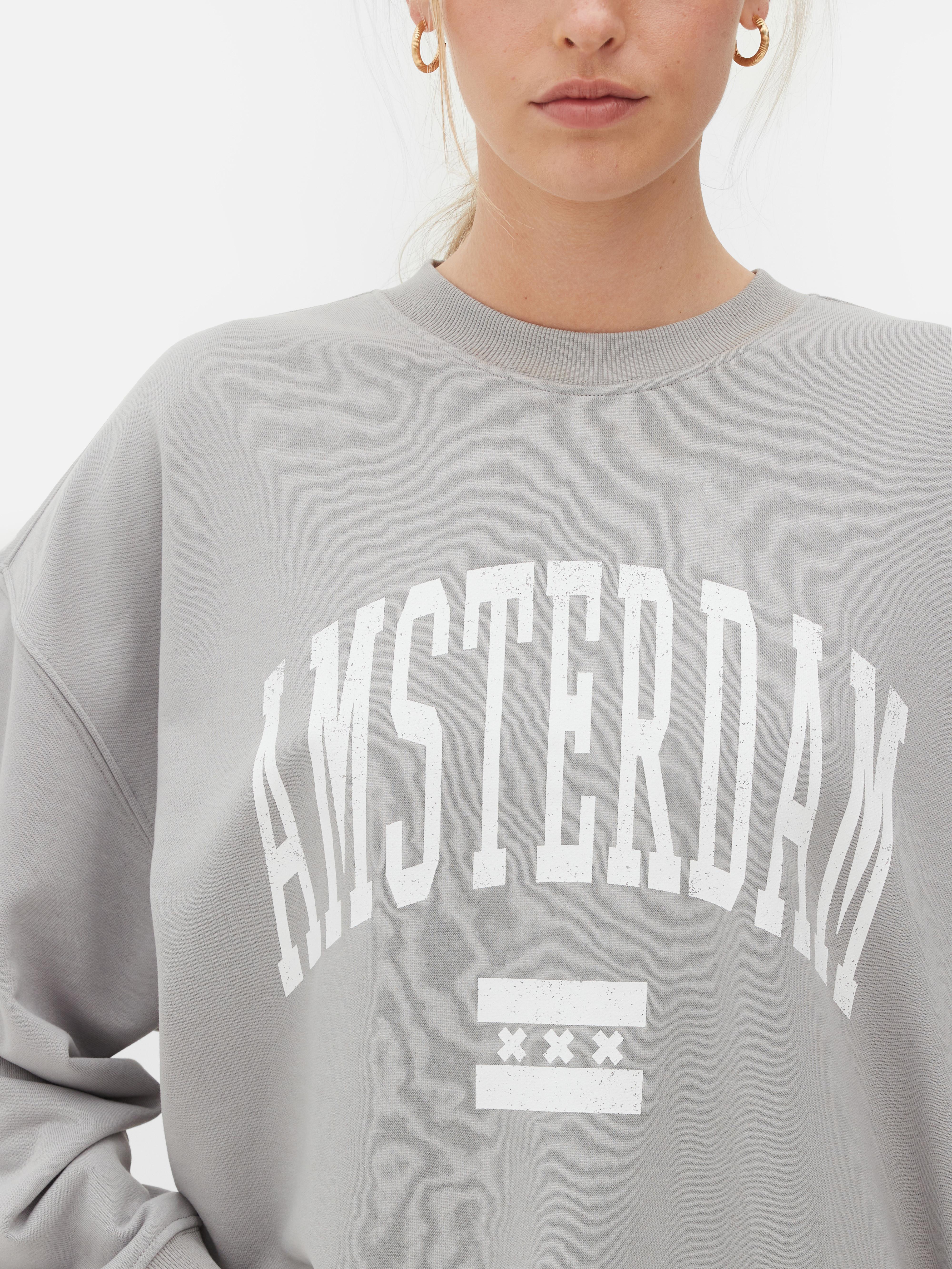 Φούτερ με στάμπα Amsterdam, oversized. Φορέστε κάτι πιο άνετο με αυτό το oversized φούτερ Amsterdam.