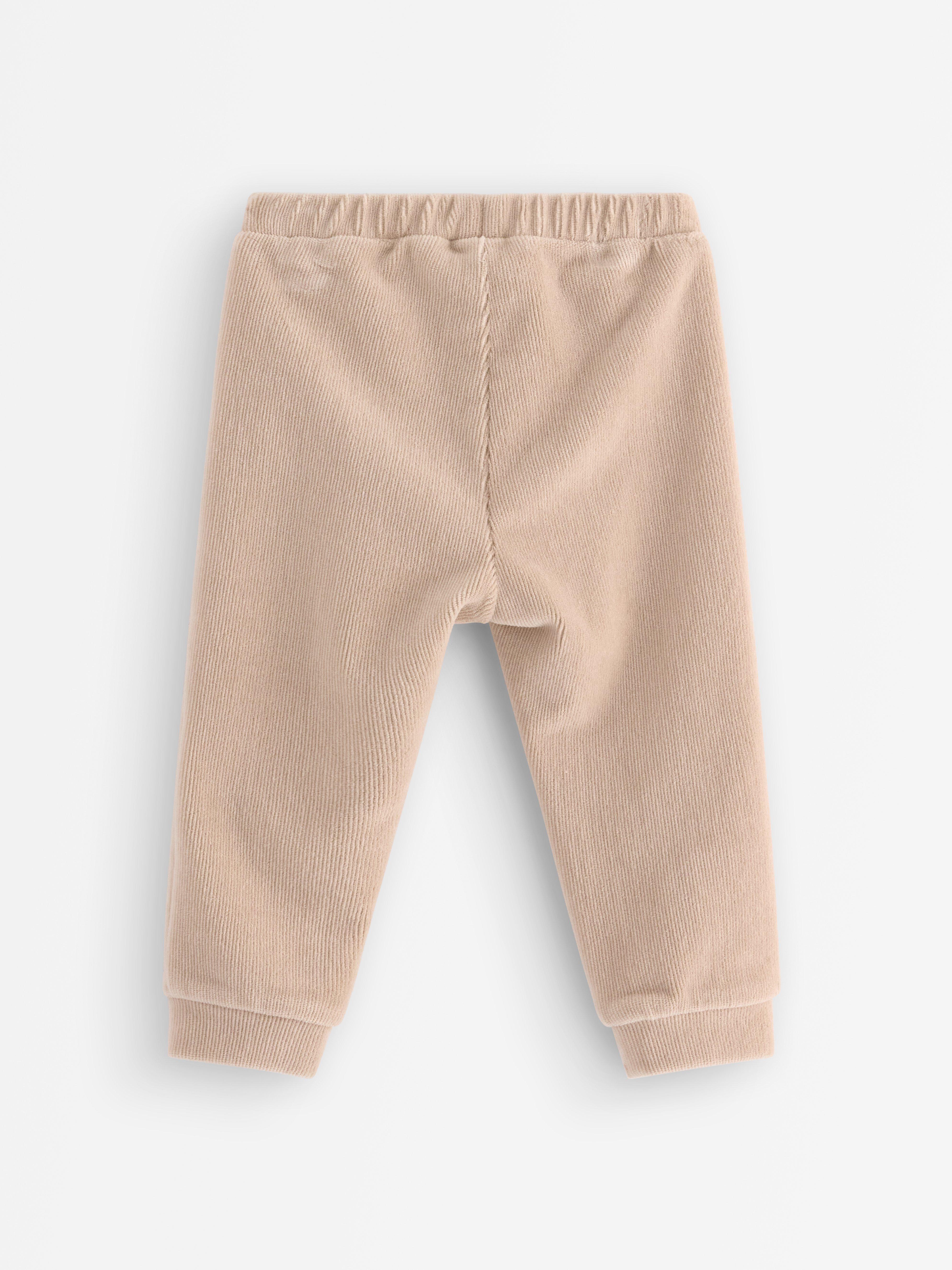 Pantalones deportivos de pana color beige