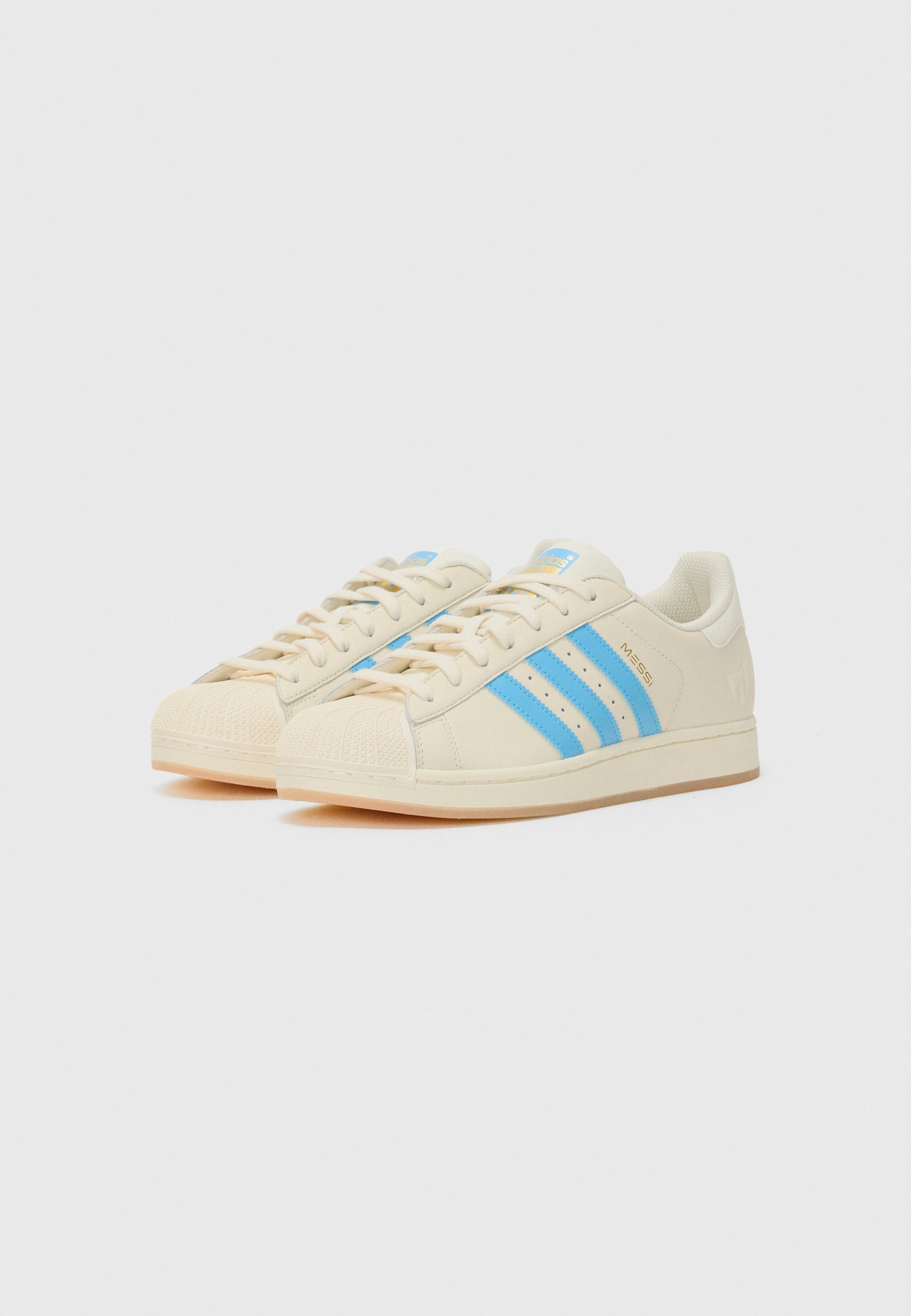 adidas Originals SUPERSTAR MESSI UNISEXE - Chaussures de football en salle - blanc crème/bleu clair/doré