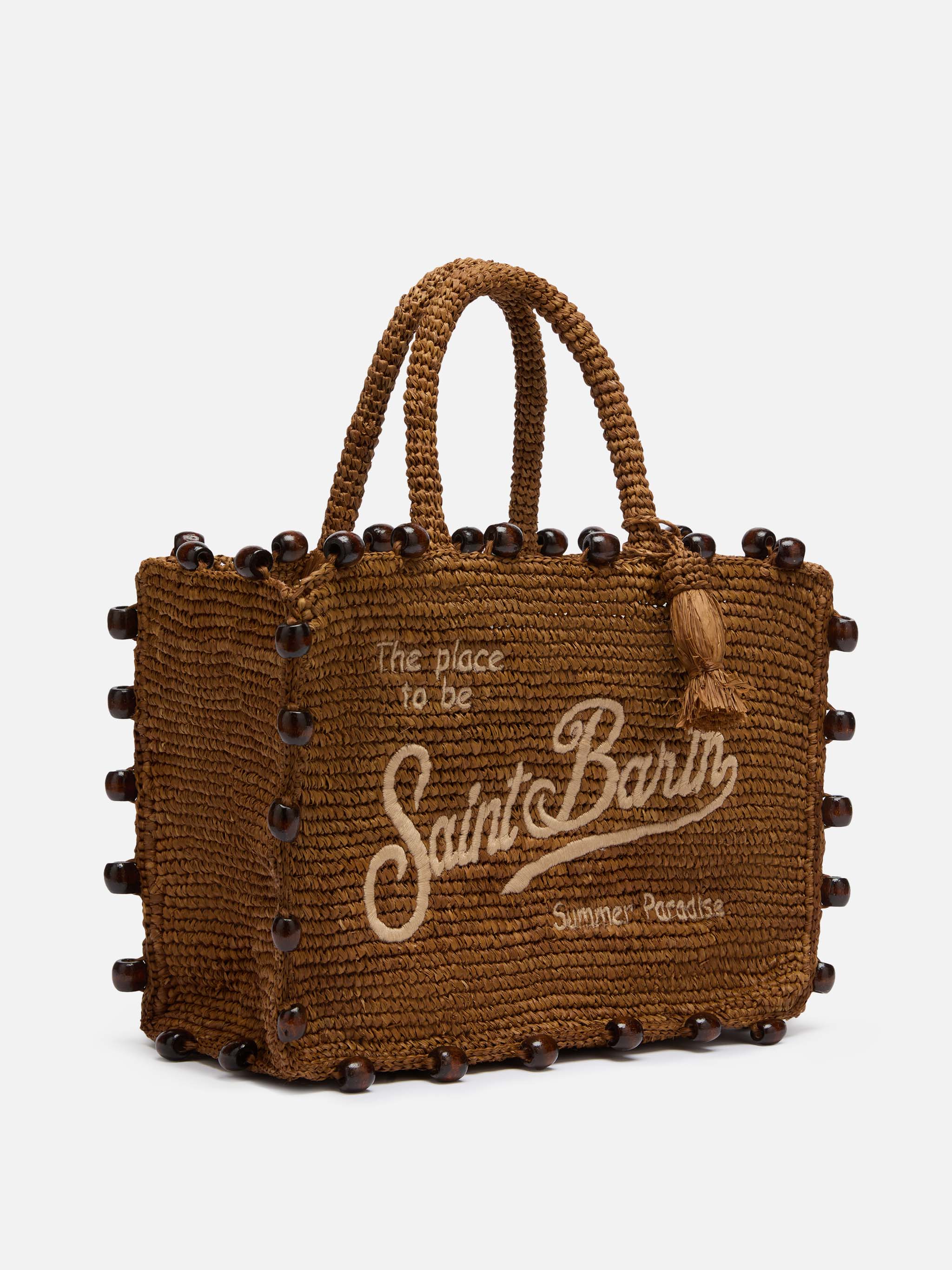 Colette tas van bruin raffia met kralen en geborduurd logo.